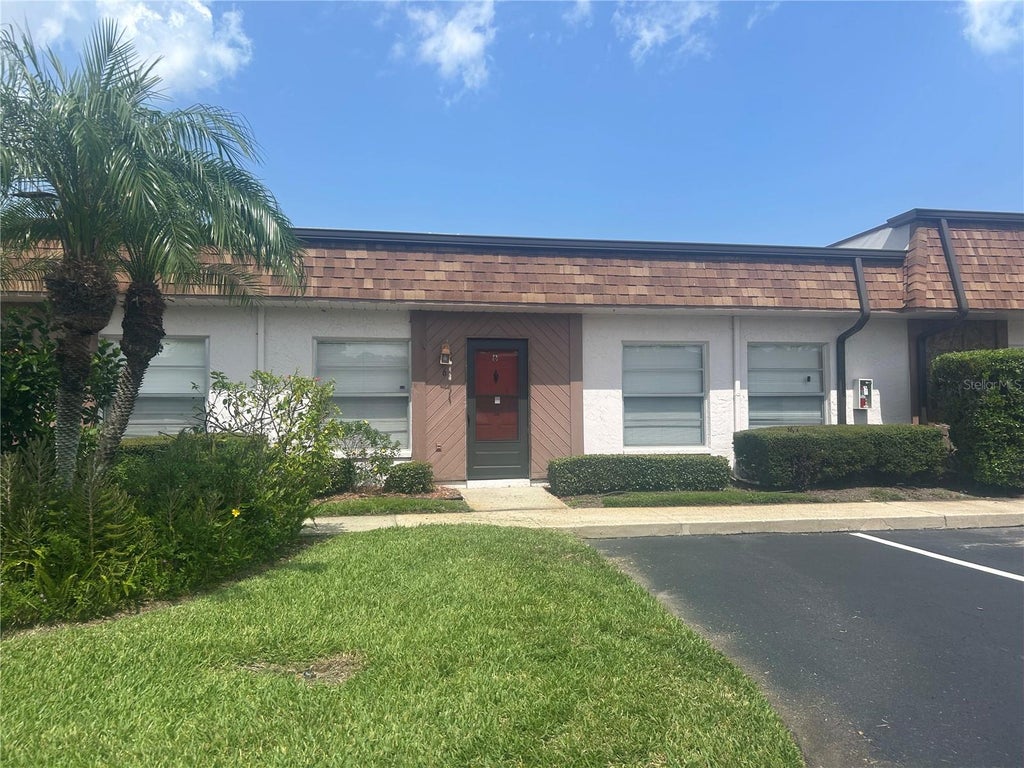 Photo of 6050 Chesham Drive #6, New Port Richey, FL 34653 (MLS # W7887410)