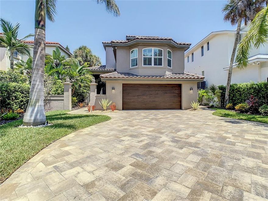 Situated on the Grand canal on beautiful Siesta Key, this waterfront gem boasts 3 bedrooms and 4 baths. Completely remodeled less than a few years ago this home features new roof, garage door, air handlers and AC units, flooring, kitchen with high end Kitchenaid appliances, paint, landscaping, and recently renovated waterfront pool. First floor bath was just finished months ago with high end fixtures and tile work. Sprawling over sized master suite with huge walk-in closet featuring three chandeliers, purse closet, sitting area or home office. Over $250K in improvements make this home ready to move in. Minutes to Siesta Village and the beach that has been named number 1 in the nation make this location very desirable. 2017 updates include new Trex decking and dock. Home includes floating dock for two jet skis and features two covered lanai areas with wood ceilings, as well as a separate Travertine patio off main living area looking out to the water. Come check out this waterfront gem before its too late ! This house could not be more perfect. Even more recent updates include: impact windows and doors, Bahamian shutters, master bath, third floor guest bath, updates to second floor bath, roof (2020), renovated lanai, plantation shutters, updated ceiling fans, driveway, sidewalk, 10k pound boat lift, landscaping, artificial turf on side of house, pool heater/chiller, engineered wood ceilings on all outdoor areas (3), outdoor railings, commercial ceiling fans in most rooms, exterior paint, shade for upstairs SGD, exterior lights, shiplap in dining area and back of island , stone walls at entry and off kitchen, LED recessed can lighting in ceilings on all three levels, interior painting and garage storage units. NO HOA fees.