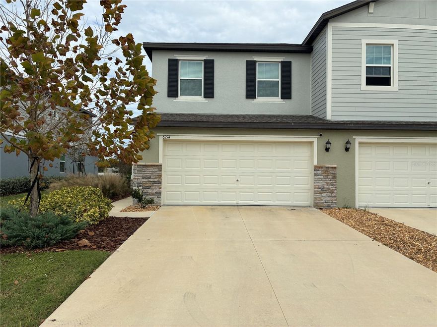 Come home to this modern 2023 corner-lot townhome in the gated community of The Townes at Lake Thomas. This stylish block-built home features 3 bedrooms, 2.5 bathrooms, and a spacious 2-car garage. The open downstairs layout includes a bright living area, dining space, and a convenient half bath, while all bedrooms are located upstairs for privacy and comfort. Situated on a prime corner lot with no rear neighbors, you’ll enjoy serene views of the large pond and open green fields. The home sits on a quiet cul-de-sac, offering a peaceful setting with sidewalks and a well-kept neighborhood feel. The gated community also provides access to a clubhouse and sparkling pool for relaxation and fun. Close to everything—shopping, dining, major roads. With easy routes into Tampa and the beaches/airports, this townhome brings together modern living, convenience, and a great location for the perfect rental opportunity.