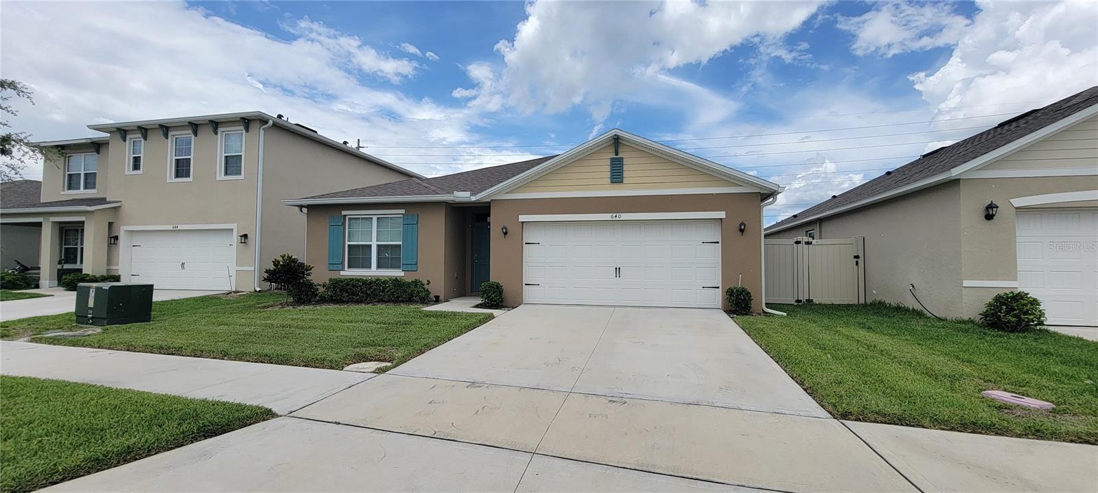 Welcome to 640 Talisi Loop, a beautifully maintained 4-bedroom, 2-bathroom home located in the sought-after Summerly community in Saint Cloud! Built in 2023 by D.R. Horton, this modern single-story residence offers 1,828 sq ft of thoughtfully designed living space with an open-concept floor plan, perfect for both relaxing and entertaining. Step inside to find a spacious kitchen with a large center island, stainless steel appliances, and granite countertops, overlooking the living and dining areas. The owner’s suite is privately situated with a generous walk-in closet and en-suite bath featuring dual vanities and a walk-in shower. Enjoy Florida living with a covered lanai and a fully fenced backyard—ideal for play, or your future garden oasis. Additional features include a two-car garage, indoor laundry room, and energy-efficient construction. Located minutes from Lake Nona, Medical City, shopping, dining, and major highways, this home offers the perfect blend of comfort, convenience, and community amenities—including a pool and playground. Don't miss the opportunity to make this move-in-ready home yours. Schedule your private tour today!