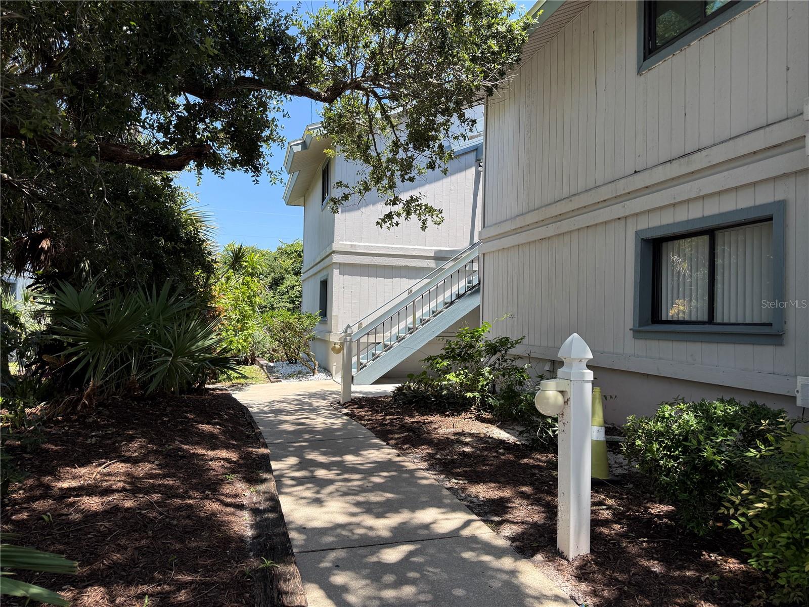 Less than a block to the ocean. Beautifully renovated 3Br, could be 4Br, 2Ba, ground floor, end-unit condo home in the highly desirable SEA Woods community. This spacious unit privately located below a canopy of oaks and lush tropical landscaping just a short distance to the main pool, clubhouse, tennis courts and one of two walkways leading to the Atlantic Ocean. Inside are upgrades including the tastefully remodeled kitchen and baths, enclosed sun room off main living area and updated door/window trim and neutral tile floors. There is no other beachside community that compares to the natural beauty of Sea Woods combined with it's resort-like grounds and incredible amenities. You'll be able to enjoy 3 pools (1 heated), tennis, shuffleboard, pickle ball, nature trails, a fitness center and two access paths to the best section of "no-drive" beach. Several shopping and dining options are nearby.