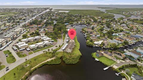 Photo of 4555 Marine Parkway #106, New Port Richey, FL 34652 (MLS # TB8529558)