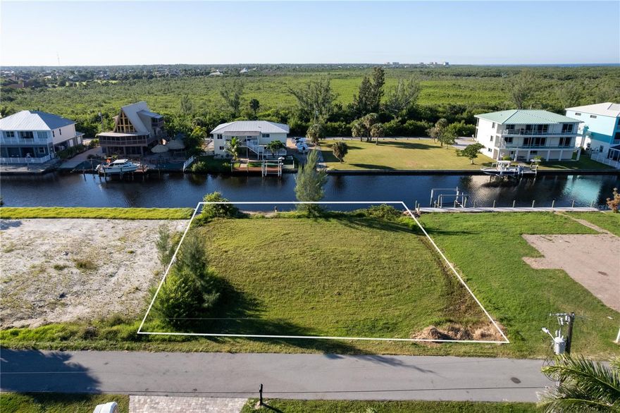 Are you looking for the perfect gulf access lot?.... Then this is one to definitely check out! Come build your dream home in the desirable community of Pirate Harbor!!! This magnificent lot offers direct access to Charlotte Harbor with no bridges.  It is literally a few minutes to big open water.  The boating and fishing around Pirate Harbor are considered some the absolute best in the area.  The community itself is unlike many in that the houses vary in size, style and age, which means no cookie cutter HOA feel, which so many are.  There are no deed restrictions in place giving residents' flexibility on how to not only build but decorate and personize their homes and land as well.  The canals in Pirate Harbor range in depth from 8 to 15 feet, giving them the opportunity to hold larger boats and with no bridges, also provide owners to have sailboats with taller masts. This is a great opportunity whether you are ready to build now or just invest while the prices are still down.