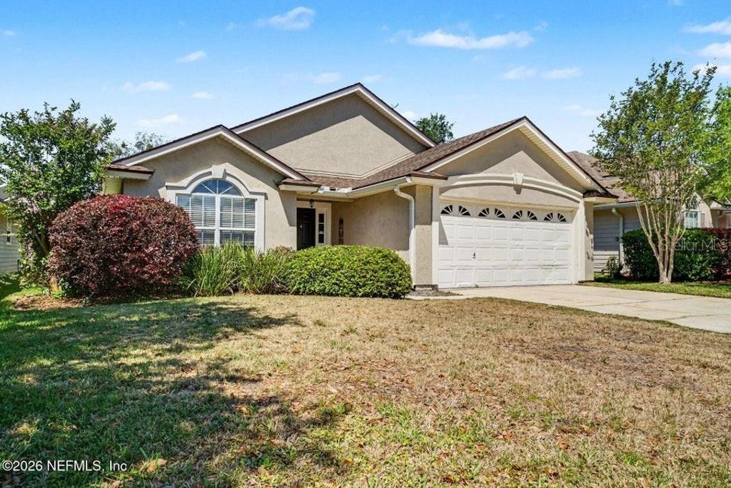 Photo of 1719 Rustling Drive, Fleming Island, FL 32003 (MLS # O6399942)