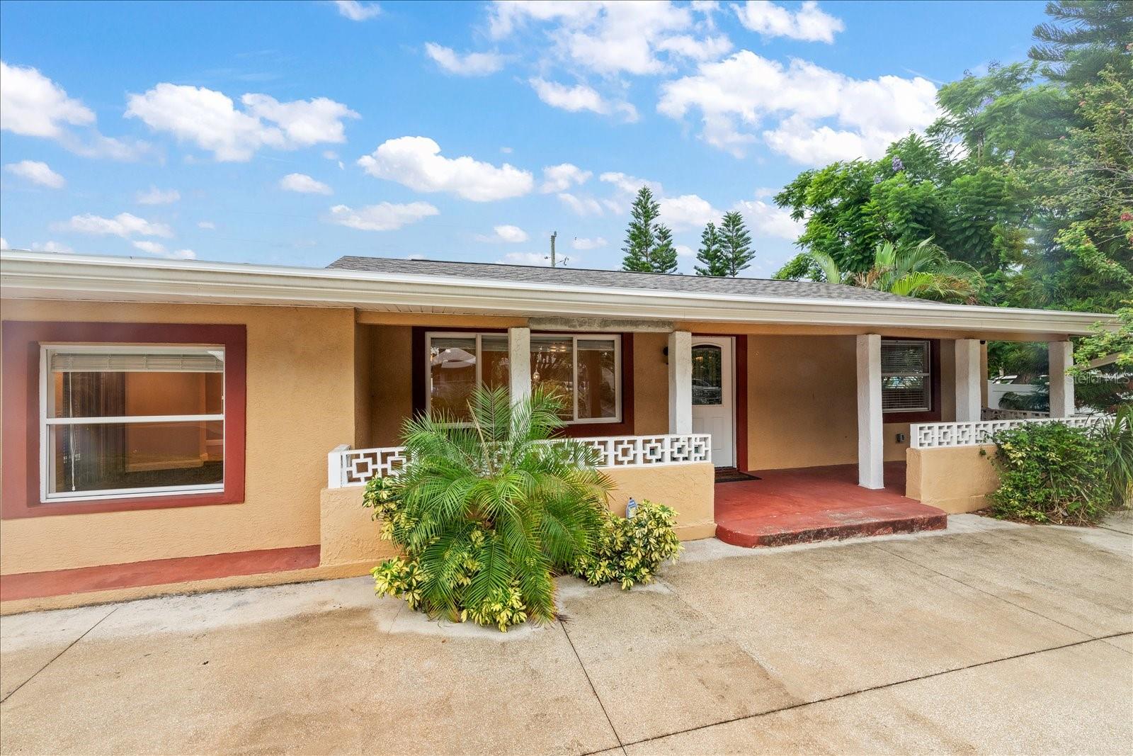 Charming 3-bedroom, 1-bath single-family home situated on a spacious double lot with plenty of space for additional parking for boat, RV, or additional driveway. Inside, you’ll find an updated kitchen featuring rich wood cabinetry, newer stainless steel appliances and plenty of storage. Remodeled bathroom with bathtub. The home offers two large living rooms, a generous laundry area, and an additional pantry space with second full size refrigerator with potential to be converted into a second bathroom. There is an additional fully enclosed Florida room for entertaining! Step outside to your private backyard retreat, complete with a newer SWIM SPA, expansive patio, and fully fenced yard. The property also includes a large shed for storage and a U-shaped driveway providing plenty of parking. Enjoy relaxing on the inviting front porch, knowing the home has a BRAND NEW ROOF and is located in a NO FLOOD ZONE. This home offers comfort, functionality, and room to grow—perfect for everyday living or entertaining. Located close to shopping, restaurants, medical facilities and minutes from Downtown St Petersburg or the beautiful Gulf Beaches!
