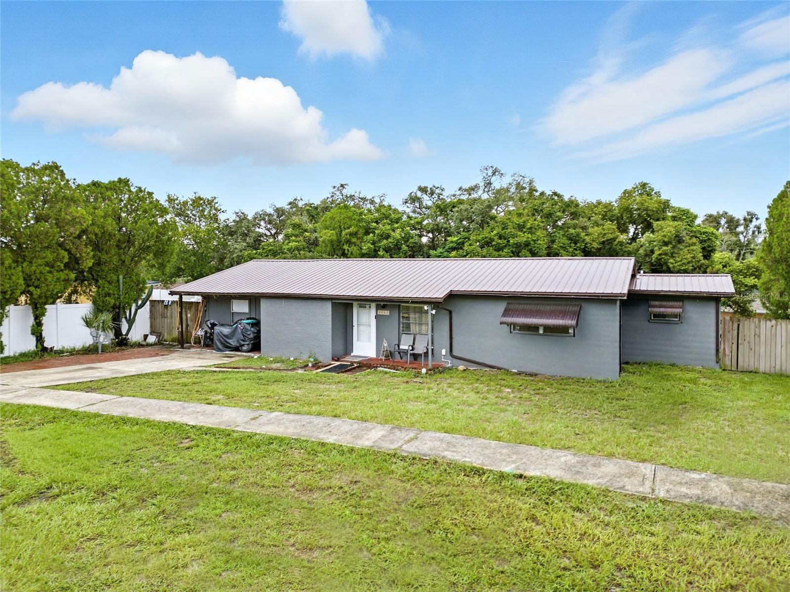 A charming single-family home nestled in the heart of Spring Hill. Built in 1972 and offering approximately 1,416 sq ft of living space, this residence features 3 bedrooms and 2 bathroom with a 3rd bathroom buit. The kitchen has granite tops and new back splash. All 3 bathroom completely remodel. The metal roof was place on may 2022 with solar panels included. The home is complete fence in and the pool area also has a seperate fence for privacy the pool is above ground also included. Complete new pain in the inside as well as the outside 2025. The home also inculdes 2 storage sheds in the back yard.