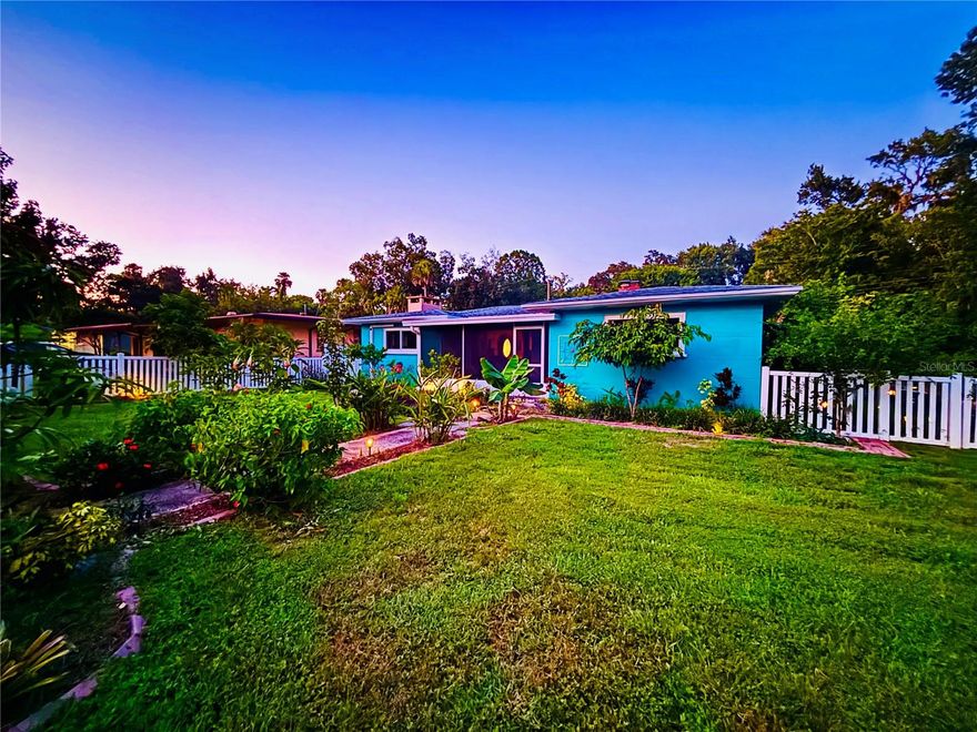 EXCELLENT LOCATION - A TRUE HIDDEN GEM! Have your cake and eat it too with this one-of-a-kind beachy-homestead bungalow, ideally located on nearly half an acre in the heart of Daytona Beach—yet just 3 miles from the sparkling shoreline. Originally built in 1957 and now beautifully remodeled, this turnkey 3-bedroom, 2.5-bath home blends old Florida charm with modern, California-inspired resort living. Step inside and experience the peaceful, spa-like ambiance with exposed beam ceilings, an original wood-burning fireplace, and a bright, open layout that feels like a tranquil meditation retreat. The home features a newly installed AC, newer roof, and updated water heater, providing peace of mind for years to come. Outside, you're in your own private oasis. The lush, fenced yard backs up directly to a protected nature preserve, offering extra privacy and a buffer from city noise. It's perfect for gardening, pets, and peaceful morning walks where you can pick wild Florida oranges along the way. The grounds are a gardener's dream, with raised beds and an extraordinary collection of exotic fruit trees including mango, moringa, loquat, Asian pear, red jaboticaba, dragonfruit, cherimoya, jujube, starfruit, passionfruit, sapote, acerola cherry, longan, fig, pomegranate, lemon, lime, grapefruit, peach, avocado, and three banana varieties. A mini barn and chicken coop add a charming touch for the aspiring homesteader. Relax on your screened lanai with a view of your garden and mini-pond, or explore the neighborhood, with nearby shopping, restaurants, and cultural highlights like the renowned Museum of Arts and Sciencesjust around the corner. Bonus: This property is offered with a buildable adjacent lot, making it ideal for multi-generational living or future expansion. Located in Flood Zone X with no history of flooding, this home offers both beauty and peace of mind. Don't miss the chance to own this unique blend of serenity, style, and location. This home is truly a rare find!