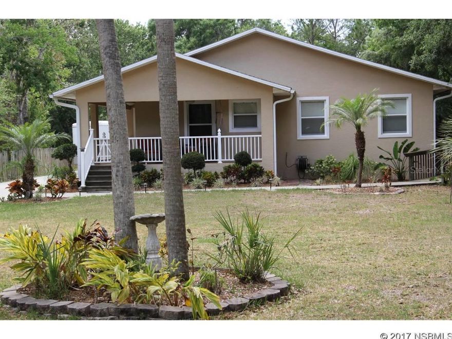 This beautiful home nestled on over two acres in a country like setting has all the storage space and features you are looking for. This home features a detached 48x40 garage with four roll-up doors, a whole house and workshop generator which runs off of a 500 gallon propane tank, a reverse osmosis water system, and high-impact hurricane windows. In addition, this home also features over 150' of paved reinforced driveway for even more vehicle, boat or RV storage as well as a 50 AMP RV hookup on the exterior of the shop and a septic system with an RV dump. Inside the home features oak cabinets in the kitchen, bath and laundry area, tile and engineered hardwood floors throughout, and vaulted ceilings which gives a grand feeling of openness. Centrally located this home is only minutes to I95 or The Indian River and is sure to please.