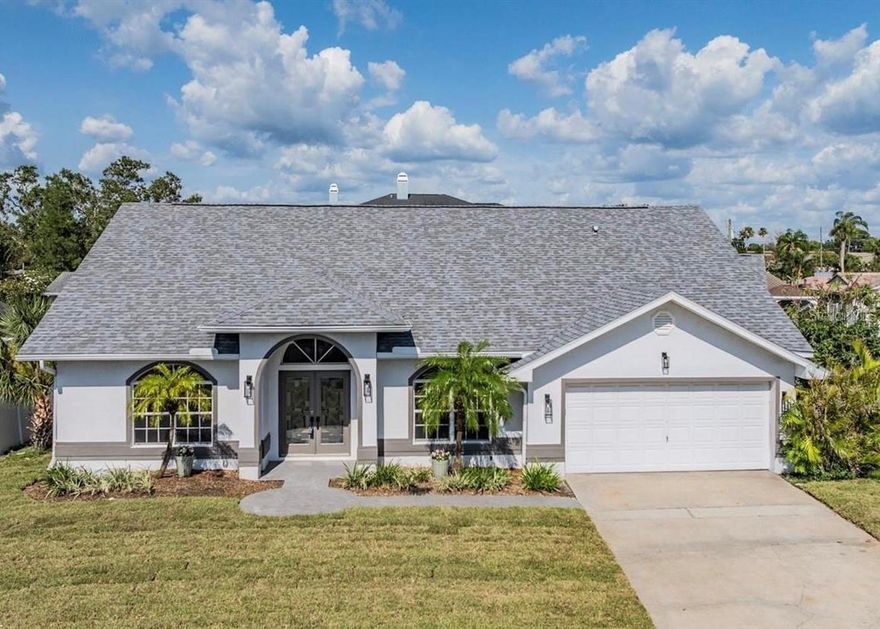 Waterfront home in Dunedin!  This home features 3 bedrooms, 2 full bathrooms, a 2-car garage, a composite wood deck/dock, and a boat lift.  For boaters, the home sits on a deep water canal with direct Gulf access.  The home is light & bright, has an open floorplan, vaulted ceiligs, split bedrooms, and water views!  The kitchen is newly renovated and features wood cabinets, granite countertops and stainless-steel appliances.  There is eat-in space in the kitchen as well as a separate dining room.  The master suite features a large walk-in closet, a fireplace, private bath & sliders overlooking the water. The master bathroom has dual vanities, a Jacuzzi tub, walk-in shower & private toilet. The guest bedroom also has a walk-in closet & sliders with a canal view. The open indoor plan & outdoor deck areas make this home great for entertaining! This property is a boater's dream. Take a short boat ride to Caladesi State Park for lunch or go fishing in the Gulf of Mexico. On land, stroll along the causeway, ride your bike on the Pinellas Trail, play golf at the local club, or enjoy the unique shops, top rated restaurants & countless downtown activities... there's plenty to do in Dunedin!  Centrally located to major thoroughfares, downtown Dunedin, the Dunedin Causeway and more! This is a MUST SEE for boating enthusiasts or buyers seeking a waterfront home!