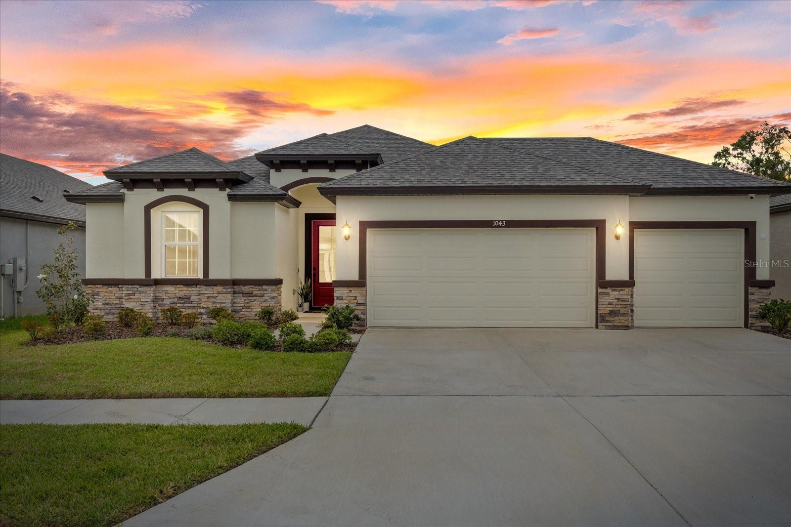 Why settle for ordinary when you can have extraordinary? This striking custom-built home by Ryan Homes, completed in 2024, is packed with standout features and thoughtful upgrades giving you the look, feel, and quality of new construction without the builder price tag. At just one year old, this home is practically brand new, but move-in ready and loaded with added value. From the moment you walk in, you’ll be wowed by the 11-foot ceilings that amplify the space and style. The entire home features beautiful tile flooring no carpet anywhere making it both sleek and easy to maintain. At the center of it all is a chef-inspired kitchen with quartz countertops, and modern cabinetry that combines function with show-stopping design. Slide open the impact-rated pocket sliding glass doors and expand your living space into the outdoors, where Florida living truly shines. The backyard offers privacy with no rear neighbors and faces west for unforgettable sunset views every evening. Whether you're planning a pool, outdoor kitchen, or just want space to relax and entertain this backyard delivers. There's plenty of room to create your dream outdoor retreat. Located just minutes from major interstates, this home also offers a quick and easy commute to downtown Tampa, shopping, dining, and everything the city has to offer without giving up the peace and quiet of a residential setting. This isn’t just a place to live it’s a bold statement of comfort, style, and smart buying. Don’t miss your chance to own a nearly-new home that checks every box of Florida Living!
