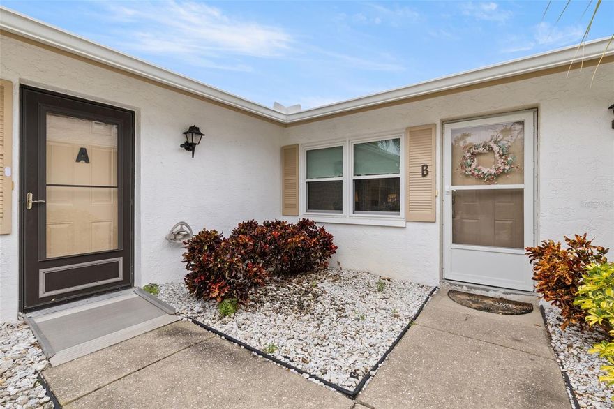 Location, location, location! Welcome to West Shore Village, a gated St. Petersburg community ideally located just minutes from downtown St. Petersburg, Gulf beaches, and the scenic Clam Bayou Nature Preserve. This beautifully updated 2-bedroom, 2-bath villa offers approximately 1,100 square feet of well-designed living space and was originally the model residence for the community.

The interior features a freshly painted and redecorated layout with a spacious living and dining area, enhanced by a mirrored wall that adds depth and light. The modern kitchen is equipped with an electric range with dual ovens, microwave, garbage disposal, and abundant cabinetry. Additional features include central A/C and heat, ceiling fans throughout, a large hall storage closet, and an in-unit washer and dryer for everyday convenience.

The primary bedroom includes a walk-in shower, while the second bedroom offers a generous walk-in closet and access to a second bathroom with a newly installed walk-in shower. A standout feature is the expansive screened lanai—one of the largest in the community—fully furnished and designed for year-round enjoyment, complete with specialty vinyl blinds, updated shades, and additional climate control options.

The property also includes a one-car garage with extra storage and a refrigerator, a new front door with updated locking features, and a newly installed patio deck with a propane gas grill, creating a seamless indoor-outdoor living experience. The property has not experienced flooding.

West Shore Village offers a range of amenities including a community pool, tennis and pickleball courts, shuffleboard, and a clubhouse, all within a gated setting. Convenient access to downtown St. Petersburg, St. Pete Beach, shopping, dining, and major thoroughfares enhances the overall appeal of this property.

This property is also available for rent; however, it presents a strong opportunity for purchase in a well-located St. Petersburg community.