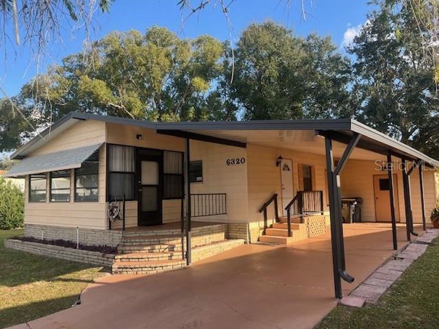 Welcome to the inviting 55+ community of Garden Grove Oaks in Winter Haven, FL. This charming manufactured home offers comfortable living in a peaceful, amenity-rich neighborhood perfect for active adults. Inside, you’ll find a bright, open layout with a spacious living area ideal for relaxing or hosting company. Brand-new flooring has just been installed, giving the home a fresh, updated feel. The kitchen offers plenty of cabinetry, solid counter space, and a cozy dining nook. The primary bedroom provides a comfortable retreat with great storage, and the additional bedroom works well for guests, hobbies, or a home office. 

Enjoy Florida living year-round in the screened porch — perfect for morning coffee or evening breezes. You’ll also appreciate the covered parking, exterior storage, and easy-care landscaping. The property sits high and dry, even during heavy storms, giving you added peace of mind. The community also provides live security in the evenings, offering an extra layer of comfort and safety.

Garden Grove Oaks is known for its friendly atmosphere and strong amenities: a clubhouse, pool, shuffleboard courts, and regular community activities that keep you active and connected. With shopping, dining, medical facilities, and Winter Haven attractions just minutes away, this home delivers comfort and convenience in a truly sought-after 55+ community.
Don’t miss your chance to make this your next Florida home.