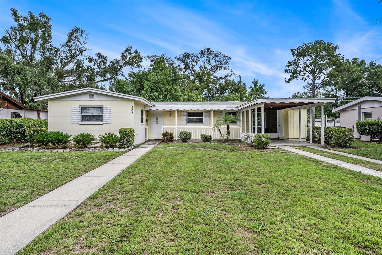 Welcome to this Forest Hills charmer! This adorable ranch-style home offers over 1,000 sq. ft. with 3 cozy bedrooms and 1 bath, sitting on nearly a 1/4 acre, fully fenced lot. Inside, you'll find a well-appointed kitchen with 42" cabinets, large breakfast bar and laminate wood flooring through out! Step outside to enjoy a beautiful, screened breezeway and patio, perfect for morning coffee, and utility area including washer, dryer and additional storage space! Your large backyard features a storage shed, several varieties of fruit trees including Avocado, Mango and Japanese Plum -perfect for gardening or relaxing under the shade. With Forest Hills Park just a short stroll away and excellent commute options nearby, this home combines comfort, convenience, and charm. Bring your personal touch and transform this sweet space into your family's home sweet home. While it awaits your personal updates and improvements, it’s the perfect opportunity to create your dream home in the highly desirable area of Forest Hills!
