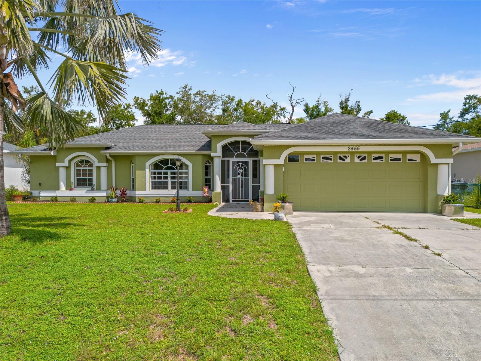 SPACIOUS 3 BEDROOM, 2 BATH, 2-CAR GARAGE POOL HOME IN NORTH PORT! This home features 1,623 sf of living space, high ceilings, laminate and tile flooring throughout. The kitchen offers an abundance of cabinetry, granite counters, stainless steel appliances, and breakfast bar that overlooks the dining and family room. Generous primary bedroom has views of the pool and lanai area, walk-in closet and private ensuite featuring dual sinks, soaker tub, and walk-in shower. Split floor plan ensures privacy, with two additional bedrooms sharing a full guest bath. Additional upgrades and features include newer roof 2022, hot water heater 2024, pool pump 2024, well pump 2024, water softener 2024, canal lot, nicely landscaped exterior, screen front entry and inside laundry room. Step outside to a large covered lanai perfect for entertaining family and friends. Located near I-75, Murdock shopping and restaurant district, schools, hospitals and outdoor activities. Don’t miss this opportunity! Schedule your private showing today!