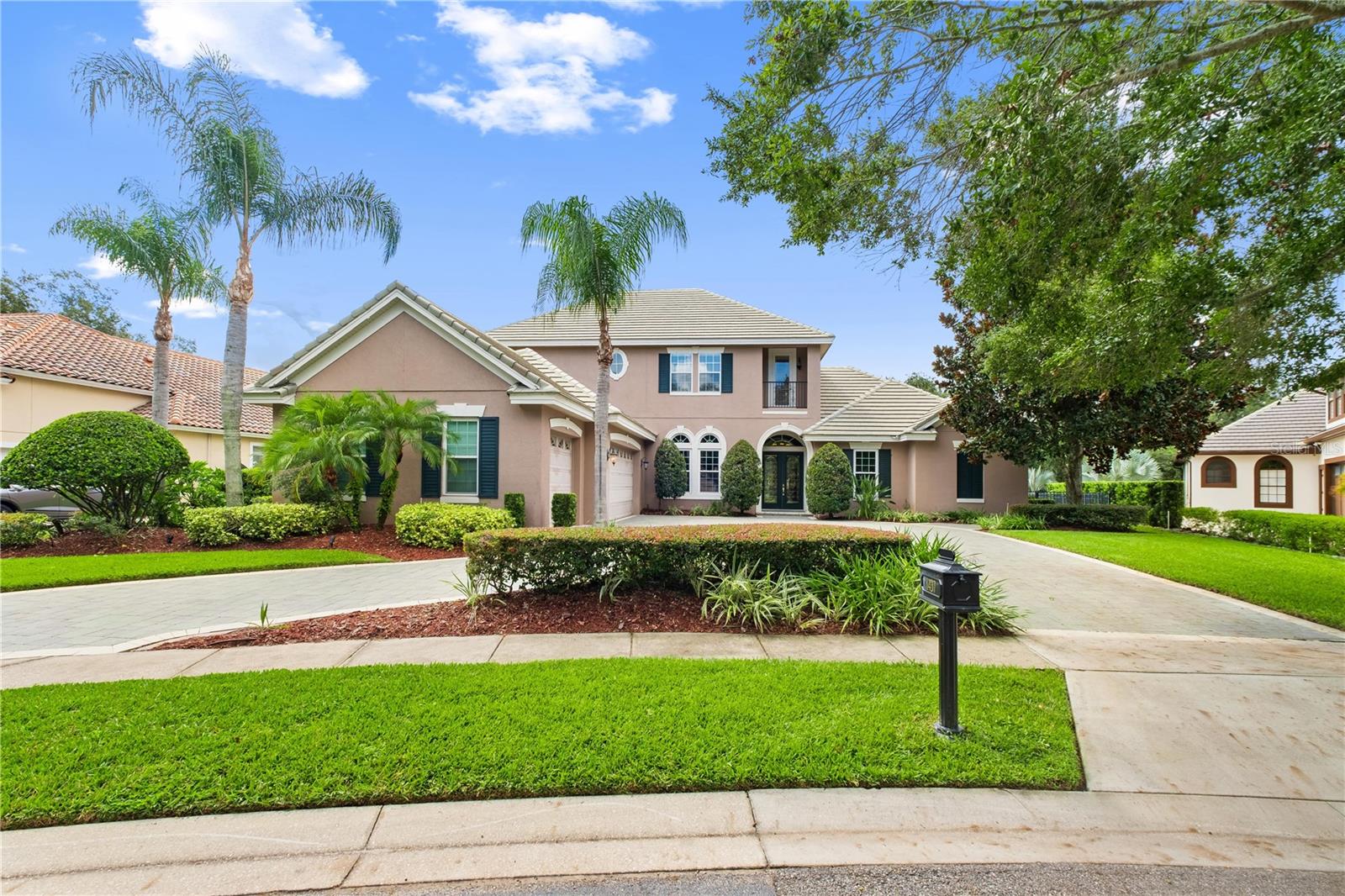 One or more photo(s) has been virtually staged. Experience the pinnacle of Florida luxury living in this masterfully designed custom home, nestled in the Reserve at Heathrow—Seminole County’s premier golf and country club community. Set on a private .33-acre lot with no rear neighbors, this virtually staged residence exudes timeless elegance and contemporary comfort, offering over 4,386 sqft of refined living space.
This stunning two-story home welcomes you with a barrel tile roof, arched windows, double entry doors, and a grand paver driveway leading to a three-car garage. Lush landscaping and mature palms enhance the curb appeal, while recent upgrades—including two new AC units, newly installed water pipe in the selected area, and energy-efficient windows on the first floor (excluding the primary suite)—ensure lasting peace of mind.
Step inside to a dramatic foyer and expansive great room with soaring ceilings, wood floors, crown moldings, and French doors that open to your own screened lanai oasis. Enjoy a sparkling saltwater pool, spa, and lush tropical landscaping—perfect for outdoor entertaining or serene relaxation.
The formal dining room is a showstopper, featuring a dazzling chandelier, tray ceilings, and tall arched windows, seamlessly connected to a stylish wet bar and a chef-inspired gourmet kitchen. Outfitted with custom cabinetry, granite countertops, a central island, and built-in appliances, this kitchen is designed for both daily living and grand gatherings.
Retreat to the palatial primary suite, a private haven with pool and garden views, direct lanai access, tray ceilings, crown molding, His & Her's walk-in closets, and a spa-like bath with dual vanities and a lavish garden tub. The main level also boasts a spacious home office with built-in shelves and custom cabinetry, crown molding. Just across from the home office, a full bathroom with direct pool access offers ultimate convenience
Upstairs, a generous game room and three spacious bedrooms await, each with walk-in closets. The Jack and Jill bathroom features seperate His & Hers vanities and balcony access, while the fourth bedroom offers a private ensuite bath—providing comfort for family or guests.
Enjoy exceptional amenities, including gated security and proximity to top-rated schools, fine dining, and world-class community features such as walking trails, sports courts, and more. This is a rare opportunity to own a showpiece home in one of Central Florida’s most exclusive neighborhoods.
Schedule your private tour today!