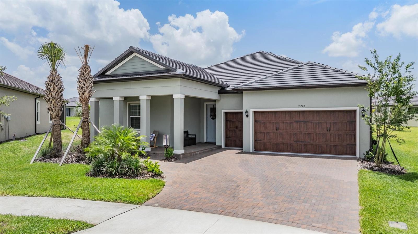 BETTER THAN NEW, JUST 6 MONTHS OLD AND STILL UNDER BUILDER WARRANTY! Situated on large pie shaped cul-de-sac lot, this property has a huge backyard! Medley Active Adult for those better than 55 years young presents an exceptional lifestyle just beyond the confines of your home. As a resident, you'll enjoy exclusive Clubhouse access with a full calendar of events daily! You will also enjoy a grill & bar, heated pool w/cabanas, ballroom, billiards room, card room, state of the art fitness center, pickleball & tennis courts, bocce ball, yoga, bingo, card games, line dancing and private active adult events. PLUS included in your HOA is a 15-acre lagoon membership w/soft, sandy beaches including a swim-up bar, kayaking, paddleboarding, obstacle course, waterslides, corn hole games, and tons of community events! This immaculate home will please even the most selective buyers! Comprised of 3 spacious bedrooms, 2 full baths, 1 half bath, and bonus room that could be used as an office or den. Your new home has quartz countertops throughout, stainless appliances and abundant cabinetry. Sliding glass doors lead to your screened in Lania and super-sized backyard. As you step inside, you'll be greeted by a seamless flow of open living spaces, making it ideal for both relaxation and entertaining. Get ready to make memories that will last a lifetime! Your dream home awaits; you will be enjoying the CAREFREE FLORIDA RESORT LIFESTYLE in your new home as quickly as you are able to move in! Gorgeous curb appeal on this block home with a 2.5 car garage including golf cart bay for your convenience. This home offers a full staircase to the upstairs storage room. Enjoy 42" Cabinets, beautiful modern backsplash, walk-in Pantry & butler's pantry in this gorgeous kitchen. Primary Suite includes ensuite bath, dual sinks, oversized shower and Walk-in Closet to keep you organized, ceiling fans, & tile flooring. Seller has also added KITCHEN BACKSPLASH, TILE IN PRIMARY SUITE, RAIN GUTTERS, WATER SOFTENER, EXTRA FANS, UPGRADED LIGHTING, SEALED PAVERS, EV CHARGING STATION in garage and SCREENED LANAI for your enjoyment. This estate home includes a walk-up staircase to the extra storage room above the garage in the attic for all your storage needs. Beautiful upgraded wood-look tile flooring is included in this energy efficient home. High-speed (ULTRAFI) internet, premium cable, yard maintenance & exterior painting are included by the HOA. Situated in close proximity to premier shopping destinations, and an array of dining options, you'll find yourself immersed in a vibrant community that strikes a perfect balance between exclusivity and convenience. Ride your Golf Cart to the Clubhouse, Publix, restaurants, Farmers Market and more right inside the neighborhood! Close to Advent Health Hospitals, BayCare Hospital, Florida Medical Clinic, Wire Grass Mall, Tampa Premium Outlet Mall, Krate at the Grove, Sam's Club, Costco, Golf Courses & Movie Theater. Easy access to I75, 275, Tampa International Airport, Downtown Tampa and Florida's amazing beaches. CDD IS ALREADY INCLUDED IN TAX AMOUNT.