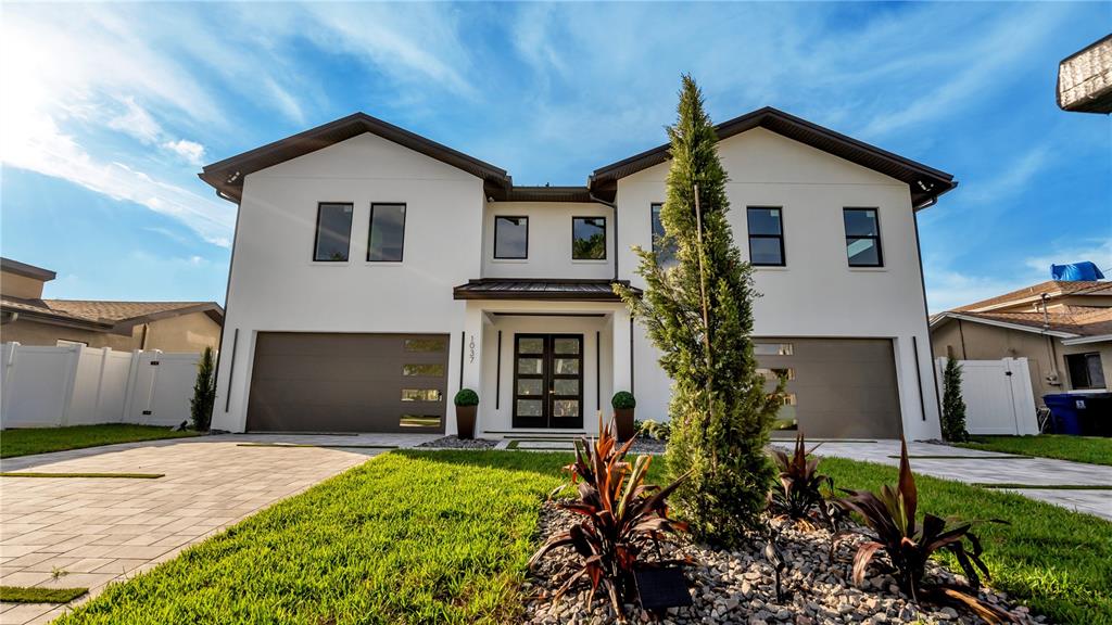 NEW CONSTRUCTION!! Look no further Custom Built Transitional Modern Home is located in the desired Yacht Club Estates neighborhood. This home features multiple unique features. From the exterior clean lines and landscape to the interior with that Italian Modern design. This home will be exactly what your are looking for. As you enter the downstairs foyer you are greeted with a large deco wall and glass wine room. Then a 12 car garage, YES a garage large enough for all those car lovers in the TAMPA BAY area. Then as to enter the main floor living you will notice the 25ft ceiling for foyer chandelier. Complete Art Deco porcelain tile throughout interior. Kitchen is equipped with all solid wood Italian design cabinetry and Miele appliances. Living/Dining room combo has all glass sliders for that open view of water, led lighted chandeliers and deco wall for that modern feel. Large master bedroom has that full luxury feeling with the large walk-in closet to the spa like bathroom with LED lighted mirrors, double shower, soaking tub and luxurious gold fixtures. Over 1500 sqft of lanai area with solid wood tongue and groove ceilings for all those outdoor parties that overlook the pool and ocean. Clear glass balcony and staircases for that clean modern look. Pool includes a raised 360 degree infinity edge heated spa, 2 large tiled sun shelves, and over 2000sqft exotic travertine with turf design. New composite oversized dock enough to park 4 boats in the deep water canal.