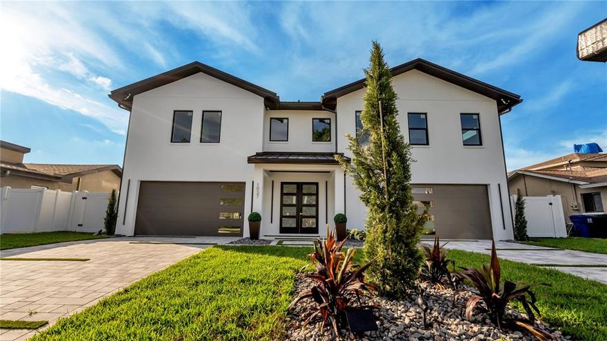 NEW CONSTRUCTION!! Look no further Custom Built Transitional Modern Home is located in the desired Yacht Club Estates neighborhood. This home features multiple unique features. From the exterior clean lines and landscape to the interior with that Italian Modern design. This home will be exactly what your are looking for. As you enter the downstairs foyer you are greeted with a large deco wall and glass wine room. Then a 12 car garage, YES a garage large enough for all those car lovers in the TAMPA BAY area. Then as to enter the main floor living you will notice the 25ft ceiling for foyer chandelier. Complete Art Deco porcelain tile throughout interior. Kitchen is equipped with all solid wood Italian design cabinetry and Miele appliances. Living/Dining room combo has all glass sliders for that open view of water, led lighted chandeliers and deco wall for that modern feel. Large master bedroom has that full luxury feeling with the large walk-in closet to the spa like bathroom with LED lighted mirrors, double shower, soaking tub and luxurious gold fixtures. Over 1500 sqft of lanai area with solid wood tongue and groove ceilings for all those outdoor parties that overlook the pool and ocean. Clear glass balcony and staircases for that clean modern look. Pool includes a raised 360 degree infinity edge heated spa, 2 large tiled sun shelves, and over 2000sqft exotic travertine with turf design. New composite oversized dock enough to park 4 boats in the deep water canal.