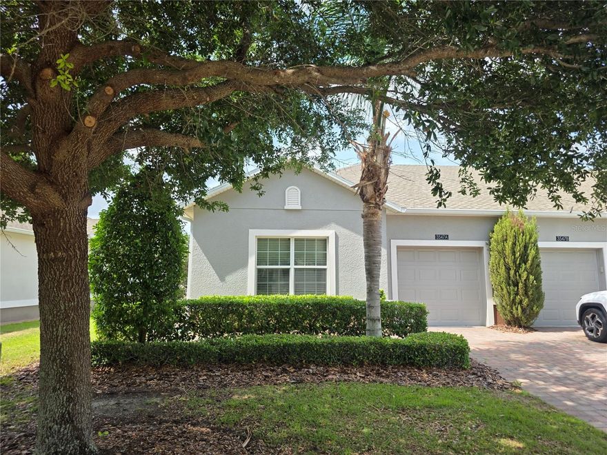 Pro pics coming early next week but don't wait, this is best buy in community. Welcome to the lifestyle you’ve been waiting for in Heritage Hills, Clermont’s premier 55+ community where every day feels like a resort getaway. Set among rolling hills and beautifully maintained grounds, this sought-after neighborhood is known for its vibrant social atmosphere, scenic walking trails, and amenities designed to keep you as active or relaxed as you choose. From morning strolls around the five-mile trail to afternoons by the heated pool and spa, life here is centered around enjoyment, connection, and ease.
This popular END UNIT St. Marten villa WITH NO REAR NEIGHBORS delivers the ideal blend of comfort and low-maintenance living, offering over 1,500 square feet with two bedrooms, two full baths, and a one-car garage. Positioned as a desirable end unit with no rear neighbors, the home is filled with natural light and enhanced privacy, creating a peaceful retreat after a day of activities. Inside, tile flooring flows through the main living areas, while brand new carpet adds warmth to both bedrooms. The open living and dining spaces are accented with new easy-lift window shades, creating a bright yet comfortable setting for everyday living or entertaining.
The primary suite is thoughtfully tucked off the living area and features a spacious custom-built closet along with a well-appointed bath showcasing dual granite vanities and a walk-in shower. The split bedroom layout places the guest room at the front of the home, offering ideal privacy for visitors. A versatile flex space provides endless possibilities as a home office, hobby room, or additional sitting area.
The kitchen is both functional and inviting, with abundant cabinetry, expansive granite countertops, a breakfast bar with pendant lighting, a pantry, and a newer range, making it perfect for casual meals or hosting friends after a day at the clubhouse.
Beyond the home, Heritage Hills truly shines. Residents enjoy a full calendar of events and clubs along with access to pickleball, tennis, basketball, bocce, and shuffleboard courts, a state-of-the-art fitness center, and beautifully designed spaces for social gatherings including a ballroom, card room, billiards room, and arts and crafts studio. The HOA enhances the lock-and-leave lifestyle with included high-speed internet and cable, exterior painting on a regular cycle, roof replacement, and reclaimed irrigation water, allowing you to focus more on living and less on maintenance.
This is more than just a home—it’s a gateway to a vibrant, resort-inspired lifestyle in one of Clermont’s most desirable active adult communities.