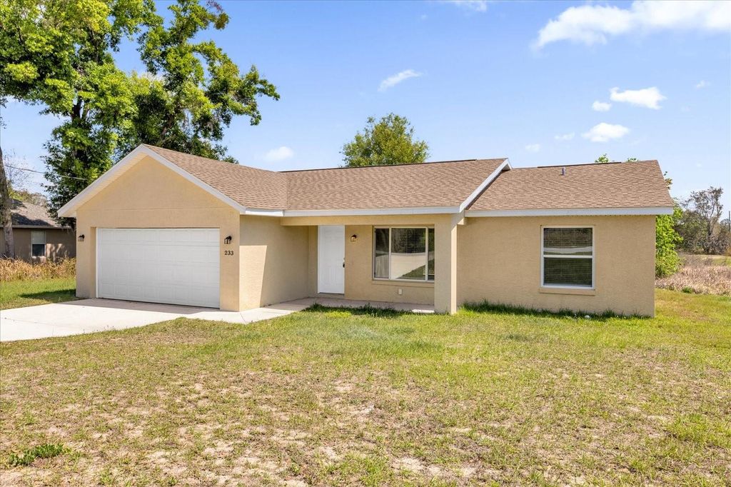 Photo of 233 Locust Pass Drive, Ocala, FL 34472 (MLS # O6392811)