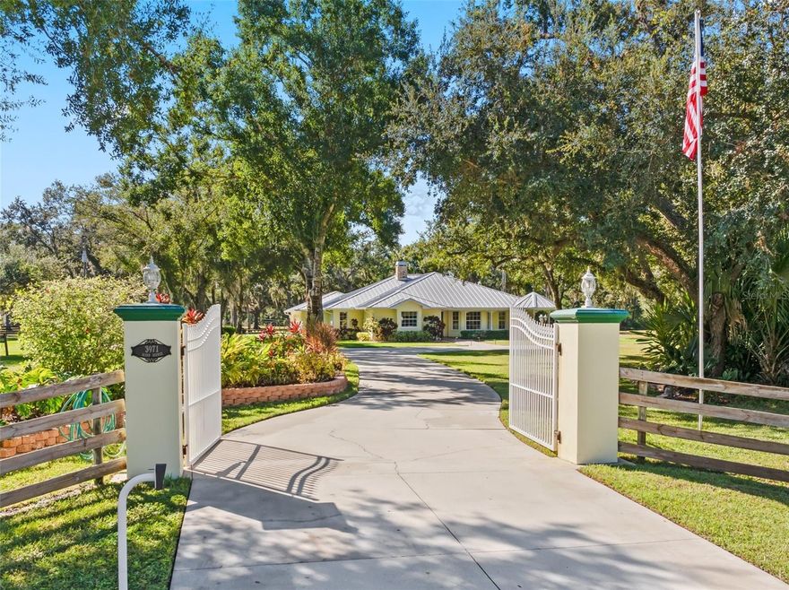 A Rare Opportunity for Privacy, Space & Refined Outdoor Living

Tucked behind a gated entrance, this 6.5-acre private estate offers a seamless blend of luxury, tranquility, and lifestyle. Resort-style outdoor living takes center stage with a screened pool and expansive lanai, summer kitchen, and an inviting fire pit—ideal for entertaining or unwinding beneath the stars.
Inside, the home features three private en suites and a versatile multipurpose room with its own entrance and a built in hide a bed. This room is perfect for guests, a home office, or fitness studio. The remaining rooms will invite you in as well. The property is fenced and cross-fenced with two pastures and is ideal for horses or other animals. The covered barn host open air stalls and a tack room as well.
This is a “A HOME DESIGNED TO BE SEEN, FELT & INSTANTLY LOVED.”  Ideally positioned moments from North Port’s renowned natural preserves, featuring miles of scenic trails for pets and equestrian pursuits.”
The estate also provides convenient proximity to city amenities, shopping, dining, and healthcare. Enjoy quick access to I-75 and travel to the Gulf Coast’s much desirable beaches, including Venice, Nokomis, and world-famous Siesta Key, all within a 30–45 minute drive.