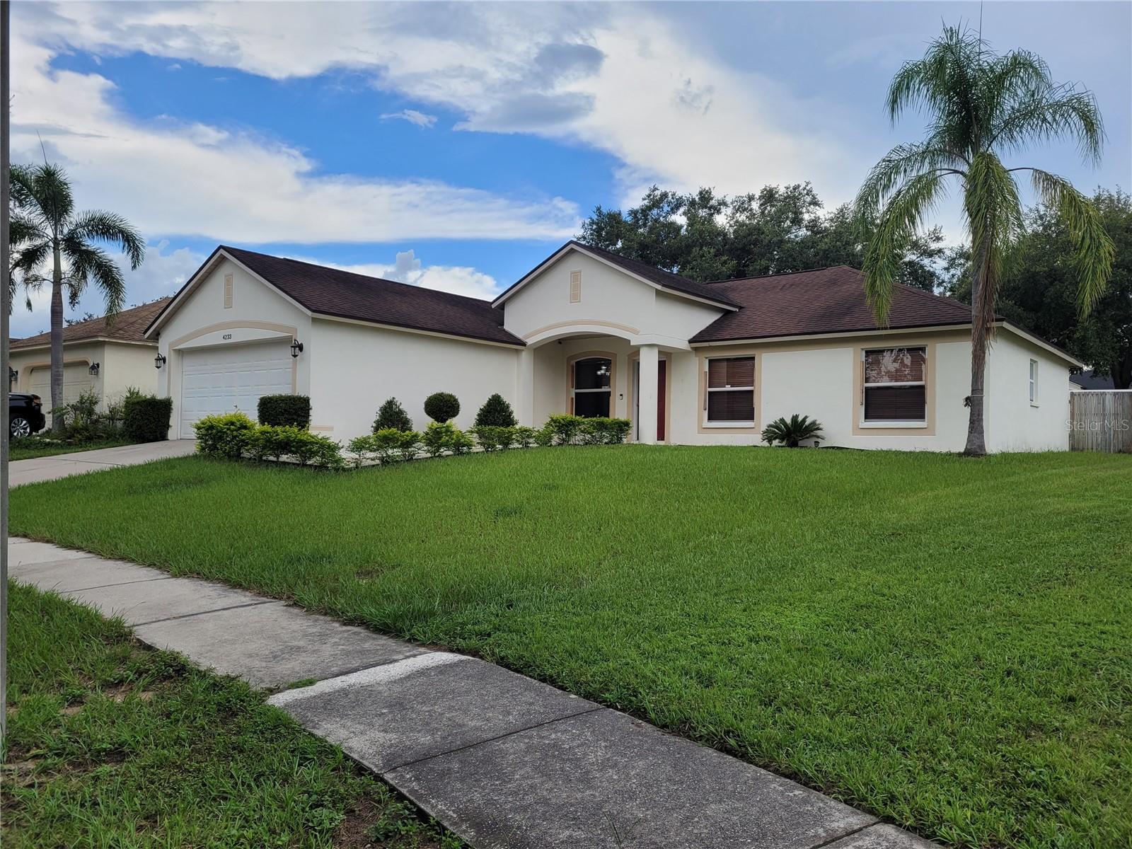 Welcome to 4233 Ember Ridge Lane, Valrico, FL 33594 – A Move-In Ready Gem in a Peaceful Community! Nestled in the heart of Valrico, this beautifully maintained 4-bedroom, 2-bathroom home offers the perfect blend of comfort, style, and convenience. With a spacious open floor plan and abundant natural light, this residence is ideal for families, first-time buyers, or anyone seeking a peaceful suburban lifestyle just minutes from Tampa. Step inside to find a welcoming living area that flows effortlessly into a modern kitchen featuring stainless steel appliances, ample cabinet space, and a breakfast bar—perfect for casual dining or entertaining. The master suite includes a walk-in closet and a private bath with dual sinks and a soaking tub. Three additional bedrooms provide plenty of space for family, guests, or a home office. Enjoy Florida living year-round in the fully fenced backyard—ideal for weekend BBQs, pets, or simply relaxing under the shade. The property also includes a two-car garage and a well-manicured front lawn that adds to its curb appeal. Located in a quiet, family-friendly neighborhood with no CDD fees and low HOA dues, this home is just minutes from shopping, dining, top-rated schools, and major commuter routes. It is the responsibility of the Buyer and Buyer's agent to verify the room sizes, room counts, HOA, community rules and restrictions, pet restrictions, deed restrictions, lot size, flood zone, etc. All room sizes are estimated. Please present all offers on FAR-BAR As-Is contract with pre-approval or proof of funds.