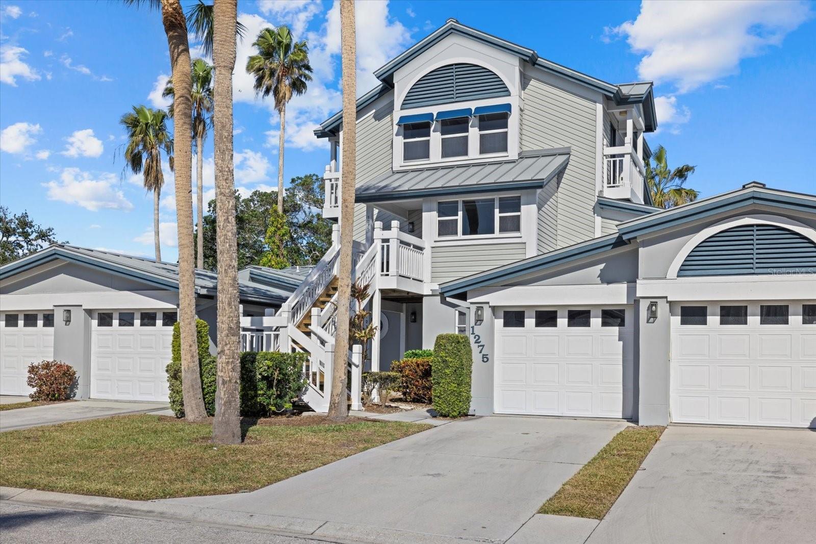 Price Reduction! An amazing year-round residence, vacation or investment property! Don't miss this rare opportunity to own a beautifully furnished 3-bedroom, 2-bath + loft unit just steps from world-renowned Siesta Beach with dedicated beach access. Recently renovated, this turnkey residence features a bright open floor plan with wood-look tile, shiplap accents, and raised ceilings in the hallways, kitchen and dining areas, a rare update in the community. The kitchen boasts solid wood cabinetry, quartz countertops, stainless appliances, and a charming, windowed breakfast nook. Enjoy multiple dining options including a formal area, bar, and a glass-enclosed lanai, perfect for entertaining. The spacious primary suite opens to a Florida room overlooking a serene pond and wildlife, with a renovated ensuite featuring dual sinks, walk-in shower, abundant storage, and a large closet. Upstairs includes a versatile loft, two guest bedrooms, and a full bath. Relax on the inviting front porch with views of Siesta’s iconic sunrises and sunsets. Additional perks include a one-car garage, private driveway, and in-unit laundry. Located in Gulf & Bay Club Bayside, a gated community with resort-style amenities: two pools, tennis/pickleball courts, clubhouse, fitness center, sauna, fishing pier, walking paths, and BBQ areas. On-site management and a one-week rental minimum make this a standout investment property with strong income potential year-round. Open for showings from June 28th to July 5th.