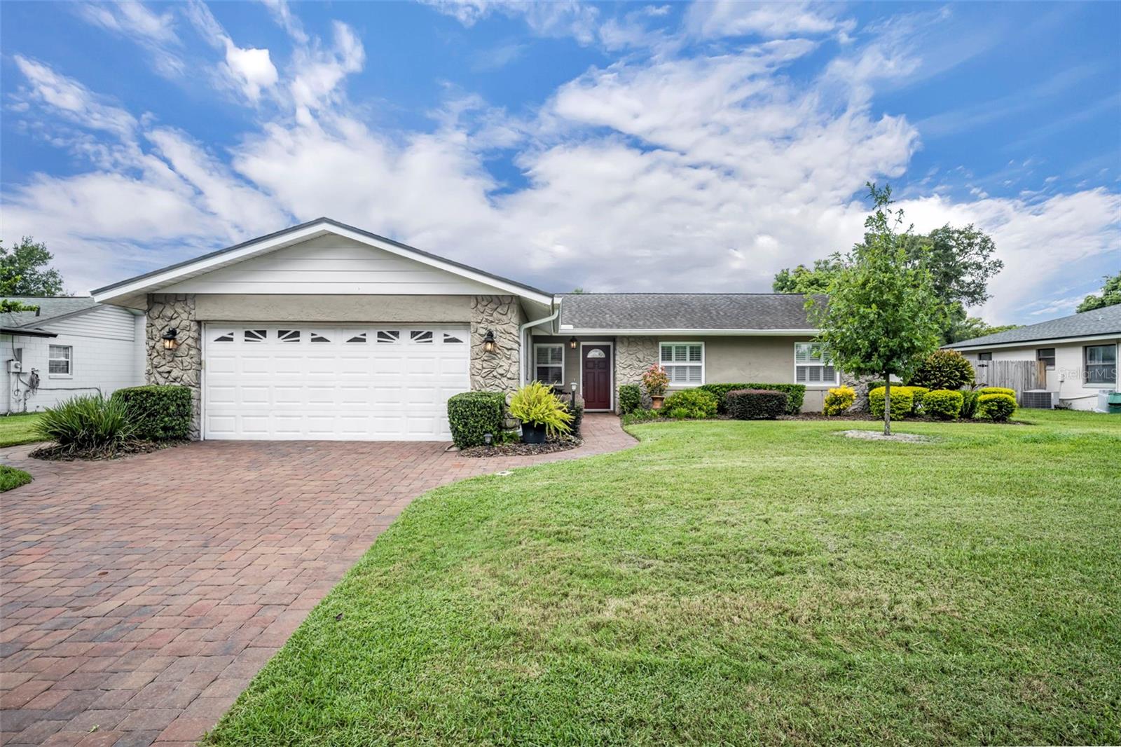 Impeccably cared for and ready for its next chapter, this Winter Park home blends timeless charm with essential modern updates. The property features a premium paver driveway, double-pane windows, offering both curb appeal and efficiency. Inside, the home has been kept in clean original condition, reflecting years of consistent maintenance and pride of ownership. Major systems have been thoughtfully updated, including a new electrical panel (2024), roof (2018), PEX piping, a water heater (2018), and an AC system (2017). The before mentioned double-pane windows are thoughtfully dressed with plantation shutters for added comfort and privacy throughout. There are two separate living spaces as well as a formal dining, in addition to a wood burning fireplace that centers the kitchen and informal eating and living areas, all dressed with crown molding. Outside, a new vinyl fence enhances the backyard, creating the perfect space for privacy and entertaining. With important improvements already addressed, this property provides a solid foundation for future personalization while remaining comfortable and fully livable as is. A wonderful opportunity to own a well-maintained home in a desirable Seminole County Winter Park location.