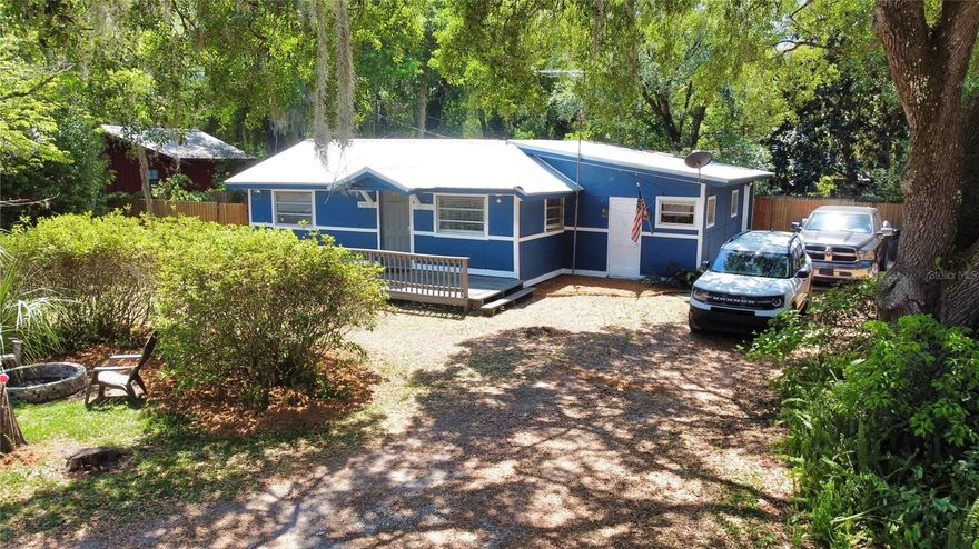 This 3-bedroom, 1-bath wood-frame home offers a great chance to settle in or invest without breaking the bank. Fresh exterior paint and a new well pump system have already been taken care of, and the rest is ready for your personal touch. The fully fenced yard offers privacy and peace of mind, while a cozy patio nook out back is perfect for relaxing with your morning coffee or winding down after a day on the water. Located just across Hwy 19 from Salt Springs Marina and the spring head, outdoor activities like boating, fishing, and swimming are practically at your doorstep — but you're not far from the city, either. Easily accessible from Ocala, Gainesville, and Palatka, this spot makes a great full-time residence, weekend retreat, or short-term rental opportunity. Enjoy the nearby conveniences like local dining, groceries, and trailheads, or just enjoy the space and simplicity of small-town life. Whether you’re looking to escape, invest, or just slow things down a little — this property is DEFINITELY worth a look.