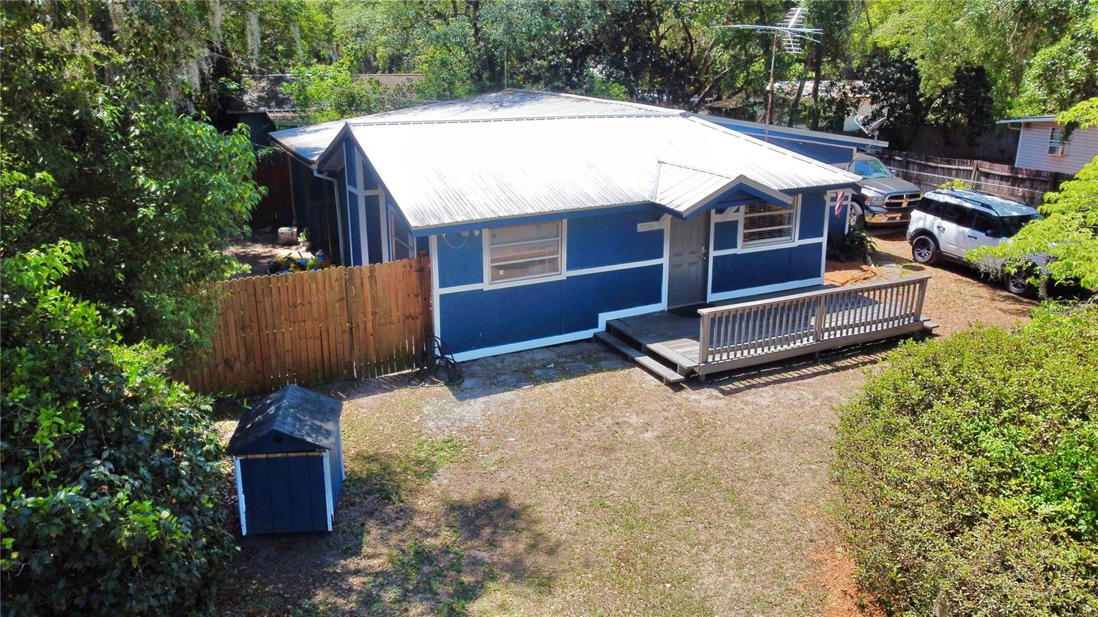 Welcome to Salt Springs — a laid-back Florida hideaway where life moves a little slower and the weekends can last forever. This 3-bedroom, 1-bath wood-frame home offers a great chance to settle in or invest without breaking the bank. Fresh exterior paint and a new well pump system have already been taken care of, and the rest is ready for your personal touch. The fully fenced yard offers privacy and peace of mind, while a cozy patio nook out back is perfect for relaxing with your morning coffee or winding down after a day on the water. Located just across Hwy 19 from Salt Springs Marina and the spring head, outdoor activities like boating, fishing, and swimming are practically at your doorstep — but you're not far from the city, either. Easily accessible from Ocala, Gainesville, and Palatka, this spot makes a great full-time residence, weekend retreat, or short-term rental opportunity. Enjoy the nearby conveniences like local dining, groceries, and trailheads, or just enjoy the space and simplicity of small-town life. Whether you’re looking to escape, invest, or just slow things down a little — this property is worth a look. Schedule your showing and see the potential for yourself!