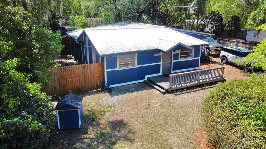 This 3-bedroom, 1-bath wood-frame home offers a great chance to settle in or invest without breaking the bank. Fresh exterior paint and a new well pump system have already been taken care of, and the rest is ready for your personal touch. The fully fenced yard offers privacy and peace of mind, while a cozy patio nook out back is perfect for relaxing with your morning coffee or winding down after a day on the water. Located just across Hwy 19 from Salt Springs Marina and the spring head, outdoor activities like boating, fishing, and swimming are practically at your doorstep — but you're not far from the city, either. Easily accessible from Ocala, Gainesville, and Palatka, this spot makes a great full-time residence, weekend retreat, or short-term rental opportunity. Enjoy the nearby conveniences like local dining, groceries, and trailheads, or just enjoy the space and simplicity of small-town life. Whether you’re looking to escape, invest, or just slow things down a little — this property is DEFINITELY worth a look.