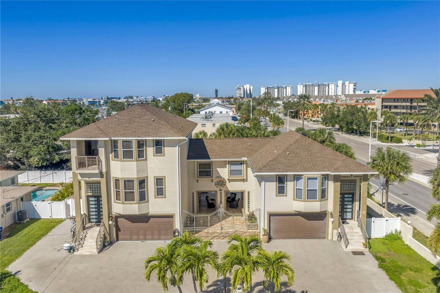 This is your perfect coastal living retreat that checks all the boxes! This outstanding, masterfully designed, custom-built 3-bedroom, 4-bath tri-level pool home with bonus room truly has it all. Located just one mile from the gorgeous, powdery white sands of Sunset Beach, you’ll love living close to the water in the “Sunset Capital.”

Enjoy everything the area has to offer, parasailing, paddleboarding, windsurfing, Blind Pass Marina, Corey Avenue shops, rooftop bars, waterfront dining, and the beautiful beaches of Pass-A-Grille and St. Pete Beach, all just minutes away.

Unwind in your own private retreat with a heated, sparkling pool and spa surrounded by lush tropical landscaping. The travertine-tiled courtyard is perfect for grilling or entertaining friends. You’ll also have plenty of parking with an oversized two-car garage and a wraparound driveway.

Step inside through the magnificent, light-filled front door to find a spacious and inviting home with soaring 11-foot ceilings, an open floor plan, and a large covered balcony. The custom kitchen impresses with granite countertops, custom cabinetry, a large island with seating, built-in oven and microwave, cooktop, and modern lighting. Beautiful coastal luxury vinyl flooring flows throughout the second-floor living area and bedroom, creating a warm and stylish space.

Outdoor balconies on both the second and third floors offer even more opportunities to entertain or simply enjoy the gentle coastal breeze. The third-floor primary suite features bamboo flooring, sliding glass doors to a private balcony, and a luxurious ensuite bath with dual vanities, a walk-in shower, a jacuzzi tub, and a huge walk-in closet. The third bedroom also offers privacy with its own ensuite bath featuring a whirlpool tub/shower combination, a private porch with distant Intracoastal views, and an extra-large dual closet.

A versatile bonus room on the first floor, overlooking the pool, can serve as an additional bedroom, game room, office, or workout room, and includes a full bath with walk-in shower.

This home truly blends comfort, space, and the best of coastal living, all in one perfect location!