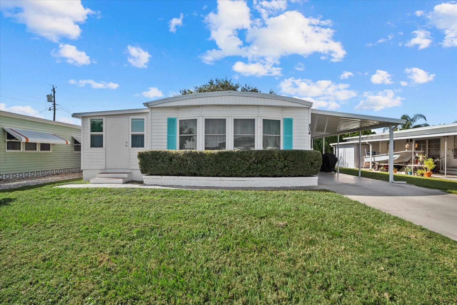 Beautiful, well maintained 2 bedroom, 2 bath home located in Heather Hills, a quiet, active 55+ community. Extra space abounds with a large Florida Room and two storage sheds. This well laid out home comes TURNKEY FURNISHED and is move-in ready. New roof and A/C, both installed this year. New washer and dryer. Private and serene backyard with new wood fencing. New bay windows and curtains. Just minutes away from the Gulf Coast's world-renowned beaches and plenty of shopping! Enjoy an active lifestyle at Heather Hills with an extensive activities calendar plus shuffleboard, club house, picnic area, and library.