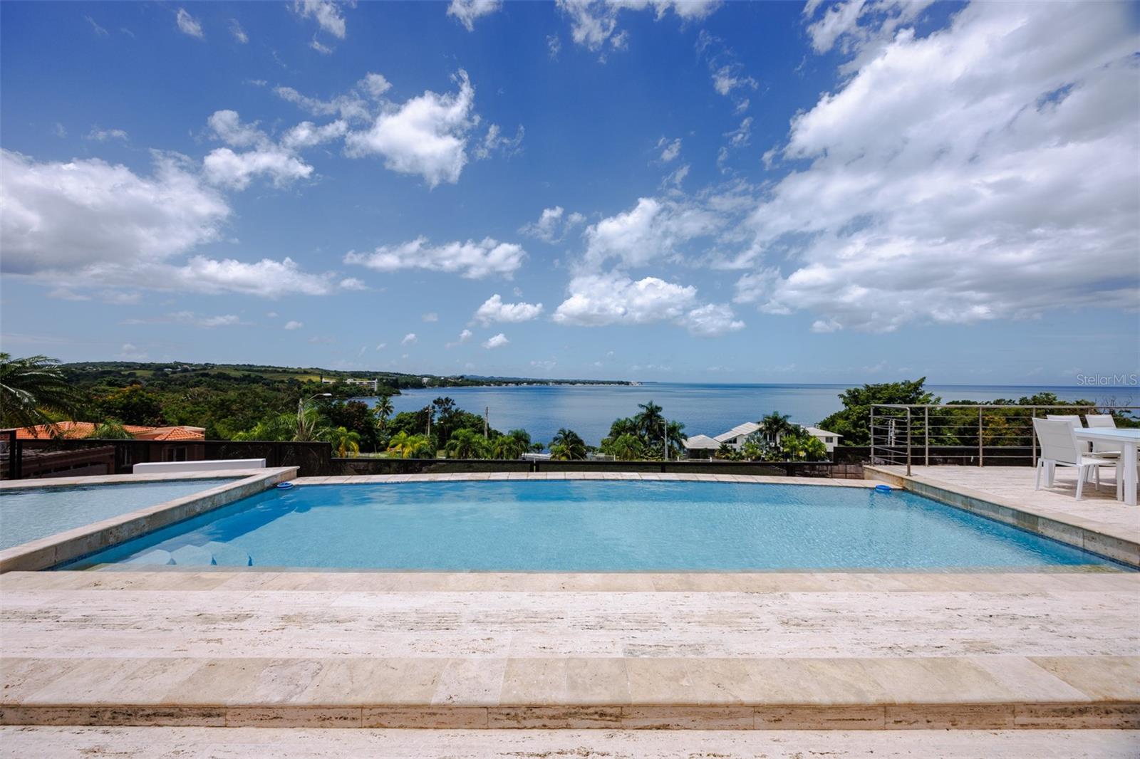 Welcome to your private Caribbean paradise in a gated community in Cabo Rojo. This luxurious 4-bedroom, 4-en-suite bathroom residence blends elegance, comfort, and stunning ocean views. The spacious, thoughtfully designed layout ensures no detail has been overlooked. Each bedroom has its own private bathroom for ultimate privacy. The open kitchen lay out, meticulously designed to satisfy the most demanding chef, comes with top-tier appliances including a refrigerator, freezer, stove, oven, and microwave. There's also an outdoor kitchen with an integrated BBQ—ideal for hosting. A dedicated laundry room features high-end washer and dryer units. The home benefits from pure water via an advanced filtration system, a full power backup generator, and a sizable water cistern for year-round comfort. Outdoors, enjoy the spectacular infinity pool overlooking the Caribbean Sea, perfect for relaxation or entertainment. The gated community provides extra privacy and security, making this sanctuary where luxury and nature exquisitely converge.