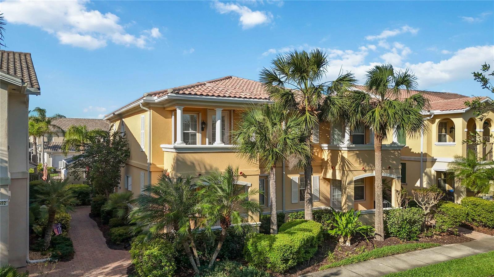 MULTIPLE OWNER FINANCING OPTIONS AVAILABLE! Discover refined living in the heart of Palmer Ranch with this seamlessly remodeled resort style townhome. Offering 4 spacious bedrooms and 3 modern bathrooms, this residence integrates contemporary luxury with Florida’s relaxed lifestyle. Fully remodeled in 2024, every detail has been thoughtfully designed and upgraded with quality finishes and refined touches. Sunlight filters through large windows, highlighting the open concept living area where luxury vinyl flooring flows seamlessly to create a bright and spacious environment reflective of Florida living. The chef inspired kitchen features a large solid surface island that comfortably seats six, complemented by brand new Samsung Bespoke appliances. Bathrooms have been updated with modern showers, vanities, tile, and fixtures, creating comfortable and functional spaces. A versatile FIRST FLOOR 4th bedroom provides flexible space for guests, a home office, or creative pursuits. Energy efficient appliances and smart climate control enhance comfort and savings throughout the home. Step through to the oversized 23 by 20 screened lanai, perfect for entertaining or relaxing year round. Additional outdoor living spaces include a private front porch and an upstairs balcony, ideal for enjoying serene mornings or evenings. The oversized two car garage offers ample storage, while accordion hurricane shutters provide added security during storm season. Low HOA fees cover cable, internet, and maintenance, plus access to community amenities including a pool, fitness center, tennis, basketball and pickleball courts, clubhouse, and playground. Experience a welcoming community atmosphere with friendly neighbors and well maintained grounds. Enjoy quick access to scenic walking trails, vibrant dining scenes, cultural hotspots, pristine beaches, upscale shopping, and more. This Palmer Ranch townhome offers a convenient and comfortable lifestyle. Don’t miss this opportunity to own a home that truly stands out with exceptional features.