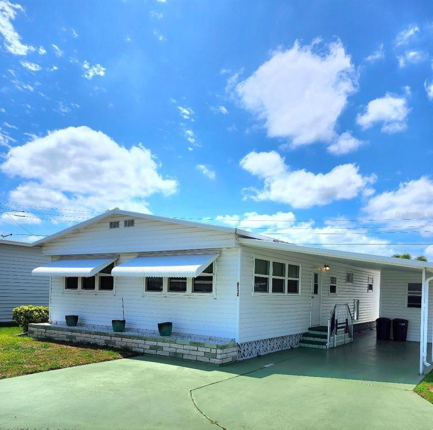 CLASSIC COASTAL LIVING. Enjoy a well-distributed 2 Bedroom, 2 Bath Mobile Home in the highly desired, active 55+ Trailer Estates community. The home sits on a generous Lot & a Half providing plenty of room for outdoor relaxation. Huge Living and Dining Room areas. The Kitchen features floor to ceiling cabinet and pantry space and a Breakfast Bar. Large Primary Bedroom with en-suite bath. Both bedrooms provide abundant storage. Newer windows. AC 2024. Two sheds; one for Laundry/Workshop, one for storage.  You own the land. No lot rent, Park Fees are included into annual real estate taxes. Trailer Estates is more than just a home, it's a lifestyle. Boaters have direct access to Sarasota Bay from the Marina. Enjoy the large, heated community pool, hot tub, gym and wood shop. The community buzzes with pickleball, shuffleboard, kayaking, horseshoes, bocce, dancing and more. A US Post Office on site. 10 minutes to the SRQ Airport. Convenient to the beautiful Gulf beaches, shopping, restaurants, the Arts and everything in Bradenton/Sarasota. Sold unfurnished. Bring offers!