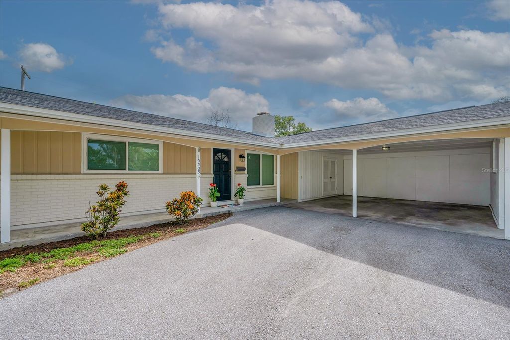 Photo of 10509 Orange Grove Drive, Tampa, FL 33618 (MLS # TB8526912)
