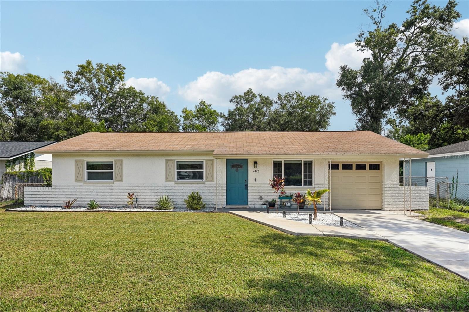 This thoughtfully updated home is ready for its next chapter. From the moment you arrive, the fresh landscaping and pops of tropical color—from passion fruit vines to papaya trees—set the tone for something special. Inside, everything feels brand new: kitchen, baths, flooring, windows, paint, and even the entire electrical system. LVP flooring throughout- no carpet! The kitchen is a standout with granite counters, stainless steel appliances, custom backsplash, and plenty of cabinet storage. The open layout flows into a sunny family room and dining nook, perfect for everyday living or casual get-togethers. Step outside to a covered patio and EXTRA large fenced yard—ideal for play, pets, or planting more. New HVAC and termite treatment give extra peace of mind. Come take a look. You might not want to leave.