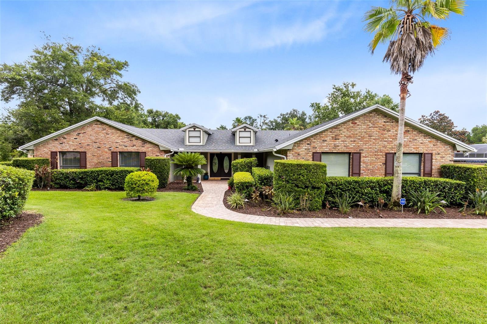 Welcome to 930 Arabian Avenue, ideally located on what is widely regarded as the most beautiful street in all of Tuscawilla—especially within the coveted Estate area, where lots span one acre or more. Lined with mature oaks and custom homes, Arabian Avenue reflects the refined charm and established character that define this sought-after country club community.
Set on an expansive homesite with a long, welcoming driveway and lush backyard views, this home offers privacy, space, and natural beauty. The property backs onto a picturesque creek, making it a perfect place to sit on the banks with a glass of wine and listen to the soothing sound of the water.
The open kitchen overlooks the family room, creating a warm and functional layout perfect for entertaining or everyday living. A cozy gas fireplace adds ambiance and comfort to the main living area, making it an ideal gathering spot in every season. Large windows throughout the home provide tranquil views from every room, bringing the outdoors in and enhancing the peaceful atmosphere.
A major highlight is the NEW ROOF installed in 2023, offering long-term protection and immediate value. The primary bathroom has been beautifully renovated with a spa-inspired design, featuring elegant finishes and a dedicated gas hot water heater for consistent comfort. The rest of the home is served by a separate electric hot water heater, providing efficient coverage throughout.
Additional features include:
*24kW Generac whole-house generator powered by propane
*Irrigation system on a deep well, helping reduce utility costs
*Spacious interior with plenty of room for everyone
*Exceptional curb appeal and serene setting
Enjoy a quick golf cart ride to the Tuscawilla Country Club and access to four nearby parks. With close proximity to SR417, you’re less than 50 minutes from Florida’s beaches and world-class theme parks, while still enjoying the calm and beauty of this established estate neighborhood.