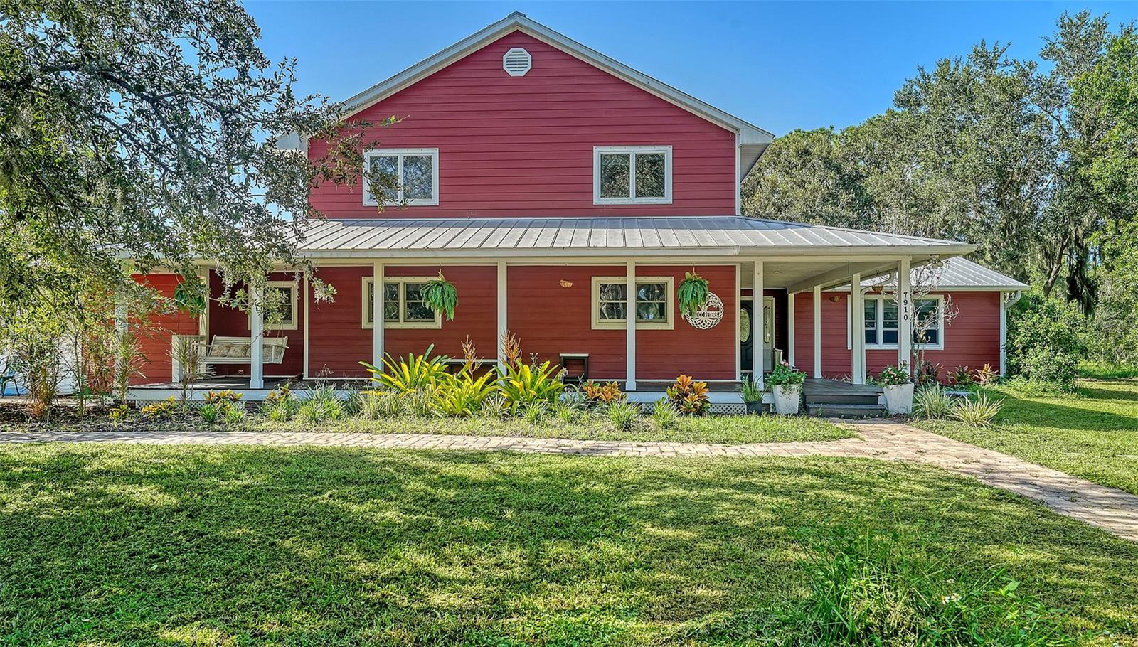 List price is starting price. Country Living in the Heart of Sarasota! Welcome to 7910 Kennedy Lane, a rare 5-acre property located in the desirable Tatum Ridge school district. This spacious 5-bedroom + den, 2.5-bath home has been thoughtfully updated with a freshly redone kitchen, waterproof LVP floors downstairs, and brand-new carpet upstairs. Major features include energy-efficient A/C, owned solar panels, a durable metal roof, and a whole-house reverse osmosis system—giving you comfort, efficiency, and peace of mind. Outside, the property offers a 2-car garage and a 2-stall barn for livestock, storage, or hobbies, along with ample space for boats, RVs, and all your toys. With no HOA or deed restrictions, you’ll enjoy unmatched freedom—all just minutes from Sarasota’s shopping, dining, and beaches.