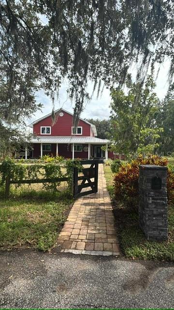 List price is starting price. Country Living in the Heart of Sarasota! Welcome to 7910 Kennedy Lane, a rare 5-acre property located in the desirable Tatum Ridge school district. This spacious 5-bedroom + den, 2.5-bath home has been thoughtfully updated with a freshly redone kitchen, waterproof LVP floors downstairs, and brand-new carpet upstairs. Major features include energy-efficient A/C, owned solar panels, a durable metal roof, and a whole-house reverse osmosis system—giving you comfort, efficiency, and peace of mind. Outside, the property offers a 2-car garage and a 2-stall barn for livestock, storage, or hobbies, along with ample space for boats, RVs, and all your toys. With no HOA or deed restrictions, you’ll enjoy unmatched freedom—all just minutes from Sarasota’s shopping, dining, and beaches.