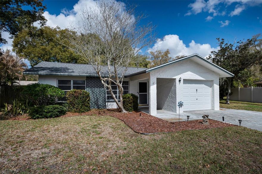Location, location!  Incredible opportunity to make this your dream home in an amazing 55+ community. Steps to the pool and clubhouse - Anchorage at Lake Tarpon features a community pool plus a clubhouse with kitchen, library, pool table and social events (all included with a low HOA fee of $42/month).  Residents can walk to the Pinellas Trail and John Chestnut Park which is a Lake Tarpon waterfront park with boat launches, dog park, sports fields, playground, hiking trails and a boardwalk. If you love nature this is the place for you!  IN ADDITION, this home offers a CAREGIVER/IN-LAW/EXTENDED FAMILY APARTMENT - 1 bedroom, 1 bath and living room with kitchenette and separate entrance!  The main portion of the home features 2 bedrooms, 2 baths, living room. dining room, Florida room, 1 car garage and screened porch. The lot is spacious.  Anchorage at Lake Tarpon is located off East Lake Road and close to shopping, restaurants. A short drive to beaches, airports and every kind of shopping imaginable. Enjoy a beautiful lifestyle in retirement. Note: shingle roof replaced in 2023 and one AC unit replaced in 2016.