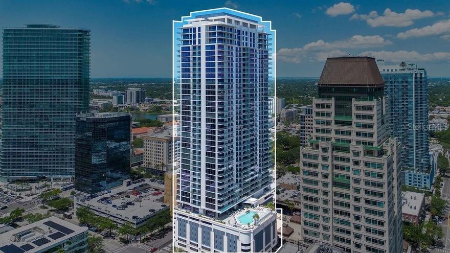 One or more photo(s) has been virtually staged. This is a rare opportunity to bypass builder timelines and added costs stepping immediately into elevated living where downtown truly becomes downstairs. Rising above the heart of downtown St. Petersburg, the visionary team behind ONE St. Petersburg and Saltaire introduces Art House—a striking 42-story architectural statement redefining modern luxury living. Perched on the 38th floor, this stunning Harmony residence offers 2 bedrooms, 2.5 baths, and 1,339 square feet of thoughtfully curated living space designed for both effortless entertaining and refined everyday living.
A seamless open-concept layout connects the designer kitchen to the expansive Great Room, flowing naturally onto an oversized terrace where breathtaking city and sunset views create a daily backdrop. Elevated finishes include builder upgrades , custom California Closets in the owner’s, guest, and utility spaces, automated window treatments by Shutter Gallery, and a stylish wine bar that adds a touch of sophistication.
Art House delivers a lifestyle as impressive as the residence itself, with resort-style amenities curated for both relaxation and connection. Enjoy a stunning pool deck with cabanas, BBQ and outdoor entertaining areas, and a state-of-the-art fitness center designed to rival top-tier clubs. Residents also have access to a private dog park with a convenient wash station, a game room with immersive simulators, and multiple beautifully designed gathering spaces featuring a catering kitchen—ideal for hosting private events. Dedicated work-from-home suites offer quiet productivity, while two private guest residences provide a seamless solution for hosting out-of-town visitors in comfort and style.
All of this is set within moments of world-class dining, culture, waterfront parks, and the vibrant energy of downtown, with the beach, Tampa, and surrounding destinations just a short drive away. Move-in ready and enhanced with premium upgrades, this is a rare opportunity to bypass builder timelines and added costs—stepping immediately into elevated living where downtown truly becomes downstairs.