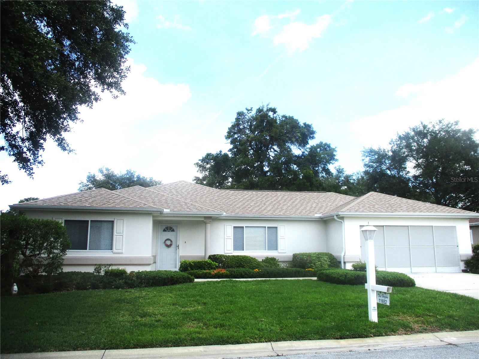 PRETTY AS A PICTURE ! This origional owner Stucco Extended Palm has many favorite features ... like the Super spacious living room that has no problem accomodating your very large screen TV. Or the kitchen that has countertops galore, beautiful oak cabinets, barely used appliances (new in 2019), Reverse Osmosis at the kitchen sink, and a cute breakfast nook area with a bay window that makes a perfect spot to enjoy your morning coffee as you plan your day. The Florida room is a bright and sunny bonus room that is ideal for hobbies, crafts, reading, and home office. Good sized bedrooms. the primary has double closets and a large one piece, easy to clean, walk in shower, the guest room has a walkin closet and guest bath has a one piece tub/shower plus a large linin closet. Inside laundry room, whole house water softener system, 20x23 garage with screens and work bench, lovely landscaping and a sprinkler system. Mostly furnished (unless buyer wants EVERYTHING donated before closing) ROOF 2018, HVAC 2023, W/H 2001. SPRUCE CREEK PRESERVE is a fun and friendly gated 55+ golf community with lots of activities and great amenities. Heated outdoor pool/spa, tennis/pickleball, shuffleboard, fitness center, billards, cards, bingo, quilting, craft clubs, social and travel clubs, potlucks, ice cream socials and holiday dinners and soooo much more !! Quiet country community surrounded by wildlife preserves while still being less than 5 miles from golf, groceries, hospitals, doctors, shopping, restaurants, hiking and biking trails. The great Central Florida location is fantastic for day trips for golf, fishing, kayaking, sightseeing, events at The World Equestrian Center, and Ocean beaches or Gulf tours to watch dolphins and manetee THERE IS ALWAYS SOMETHING TO DO IN FLORIDA !!