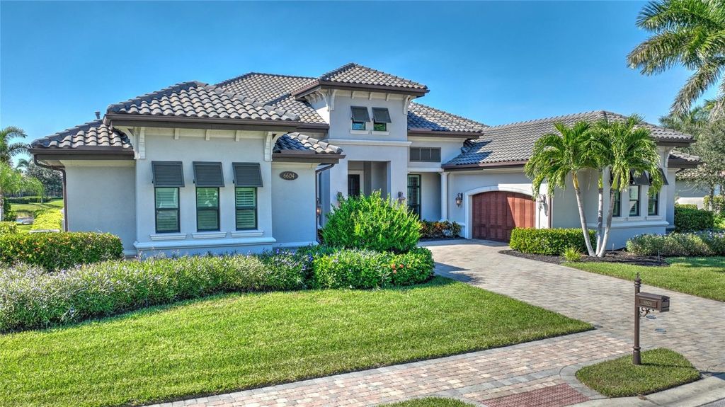 Photo of 6604 Costa Circle, Naples, FL 34113 (MLS # OM715377)