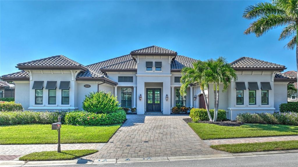 Photo of 6604 Costa Circle, Naples, FL 34113 (MLS # OM715377)