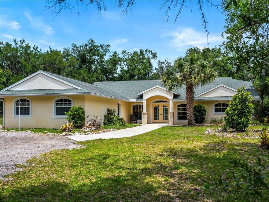 Nature Lovers!  Rare opportunity to own a private estate in the exclusive gated community of Oak Ford in Sarasota. Located on a quiet cul-de-sac, this 5.55-acre property offers exceptional privacy and flexibility just minutes from shopping, dining, golf, and the world-renowned Gulf beaches, including Siesta Beach and Lido Beach.

The home features a split floor plan with 3 bedrooms, 3 bathrooms, multiple living areas, a spacious kitchen, and a private heated pool. The layout offers an excellent opportunity to update and customize to your preferences. Additional features include a roof installed in 2015, two A/C units installed in 2015, a pool heater installed in 2019, and a gas fireplace with a floor-to-ceiling coral stone surround supplied by an exterior propane tank.

A long circular tree-lined driveway leads to a secluded setting surrounded by Florida's natural landscape and abundant wildlife. The property is ideal for entertaining, with ample space for pool gatherings, outdoor events, and evenings around a campfire.

The acreage provides endless possibilities for recreation, gardening, or creating your own private retreat. There is plenty of room to add a detached garage, workshop, barn, or guest house. Horses and other farm animals are permitted, making this an ideal property for buyers seeking acreage with room to expand while enjoying the privacy and tranquility of Oak Ford.

Despite its peaceful setting, the property is conveniently located near Lakewood Ranch, University Town Center, and major roadways, offering easy access to the best of Sarasota's amenities and coastline.