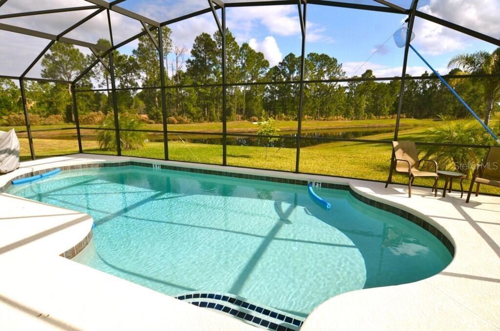 4 bedroom 3 full baths. Cable, internet, lawn care, 24 security all included. This house was the model home at one point. Vaulted ceilings and very large lanai. Fully furnished. 24 hrs gated community. Very well taken care of. Owners hand on fixing every little detail. It has a commercial electric pool lift. Pool screens have a privacy film. The pond and the forest right outside.The garage is fully closed and insulated. The modern kitchen features updated appliances and ample counter space. Enjoy the serene backyard, appropriate for relaxation or entertaining. Located in a desirable neighborhood, this home provides convenient access to local amenities and attractions. Don't miss the opportunity to make this house your new home! Vaulted ceiling and several fans around the house. The community amenities are two houses way it has a clubhouse, which includes a fitness center, lounge area, large pool, playground, business center. Hard wire cameras no monthly fee.