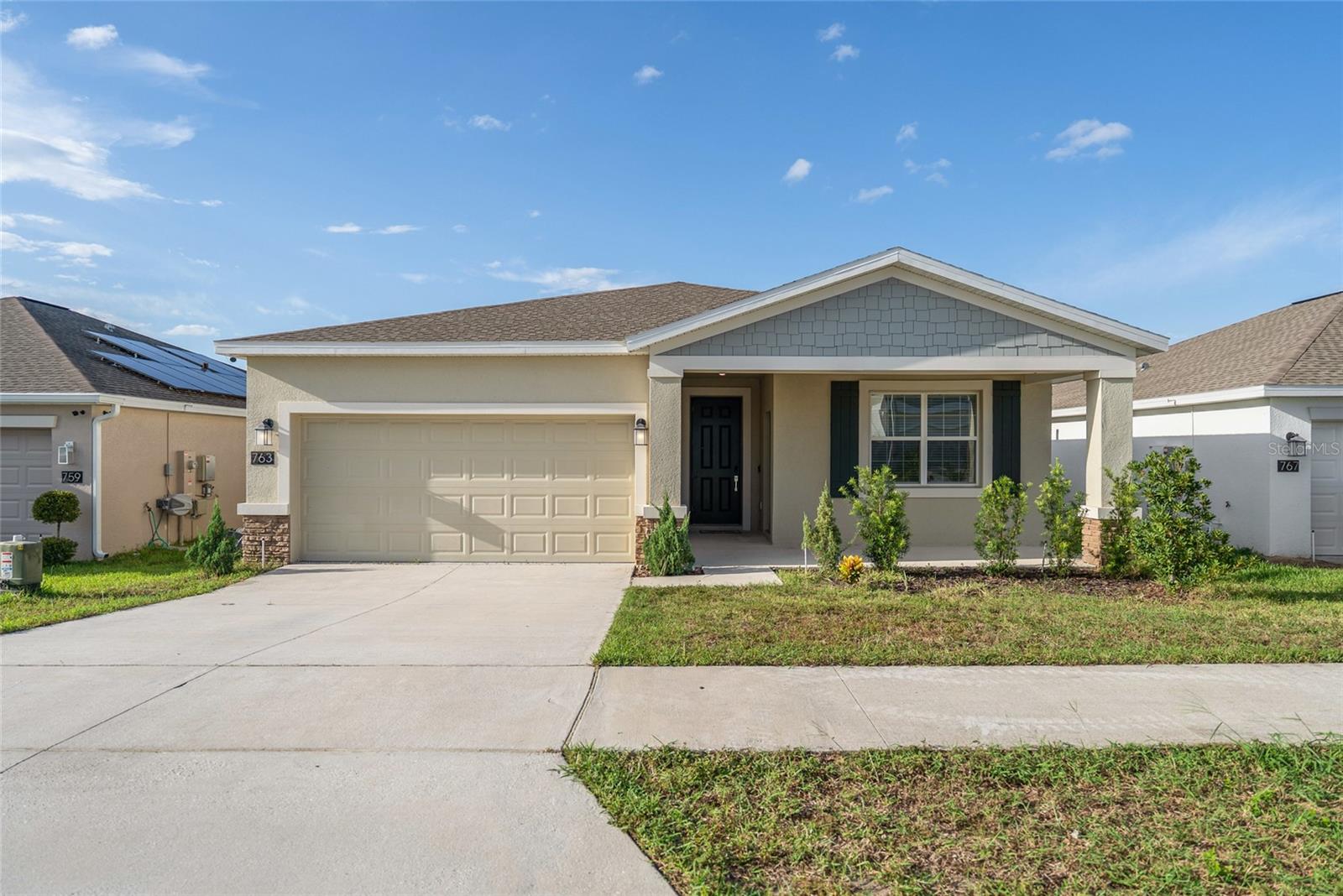Welcome to this thoughtfully crafted residence in Haines City’s coveted Magnolia Park neighborhood! Featuring 4 spacious bedrooms, a private-entry mother-in-law suite, 3 full bathrooms, and a versatile office that can easily serve as a 5th bedroom, this home blends modern design with everyday comfort and thoughtful functionality. The homes interior features an open-concept layout with soaring ceilings and abundant natural light, creating a welcoming and airy atmosphere throughout. The owner’s suite offers a private retreat with a generous walk-in closet and spa-inspired bathroom, including dual vanities, a glass shower, and elegant fixtures. On the opposite side of the living area, two additional bedrooms share easy access to the second full bathroom. The spacious living and dining space provides the perfect setting for family gatherings and special occasions. The modern kitchen is designed for both daily living and entertaining, featuring quartz countertops, stainless steel appliances, and a breakfast bar for casual meals. The exterior offers a spacious covered lanai, an inviting extended front porch, and a convenient attached 2-car garage designed for both style and practicality. Living in Magnolia Park means access to resort-style amenities, including a community pool, playground, and dog park, all set within a vibrant neighborhood close to shopping, dining, and highly rated schools. With convenient proximity to I-4, Walt Disney World, Universal Studios, Legoland, and more, this home delivers the perfect balance of space and convenience ideal for a versatile family residence, vacation retreat, or investment property.