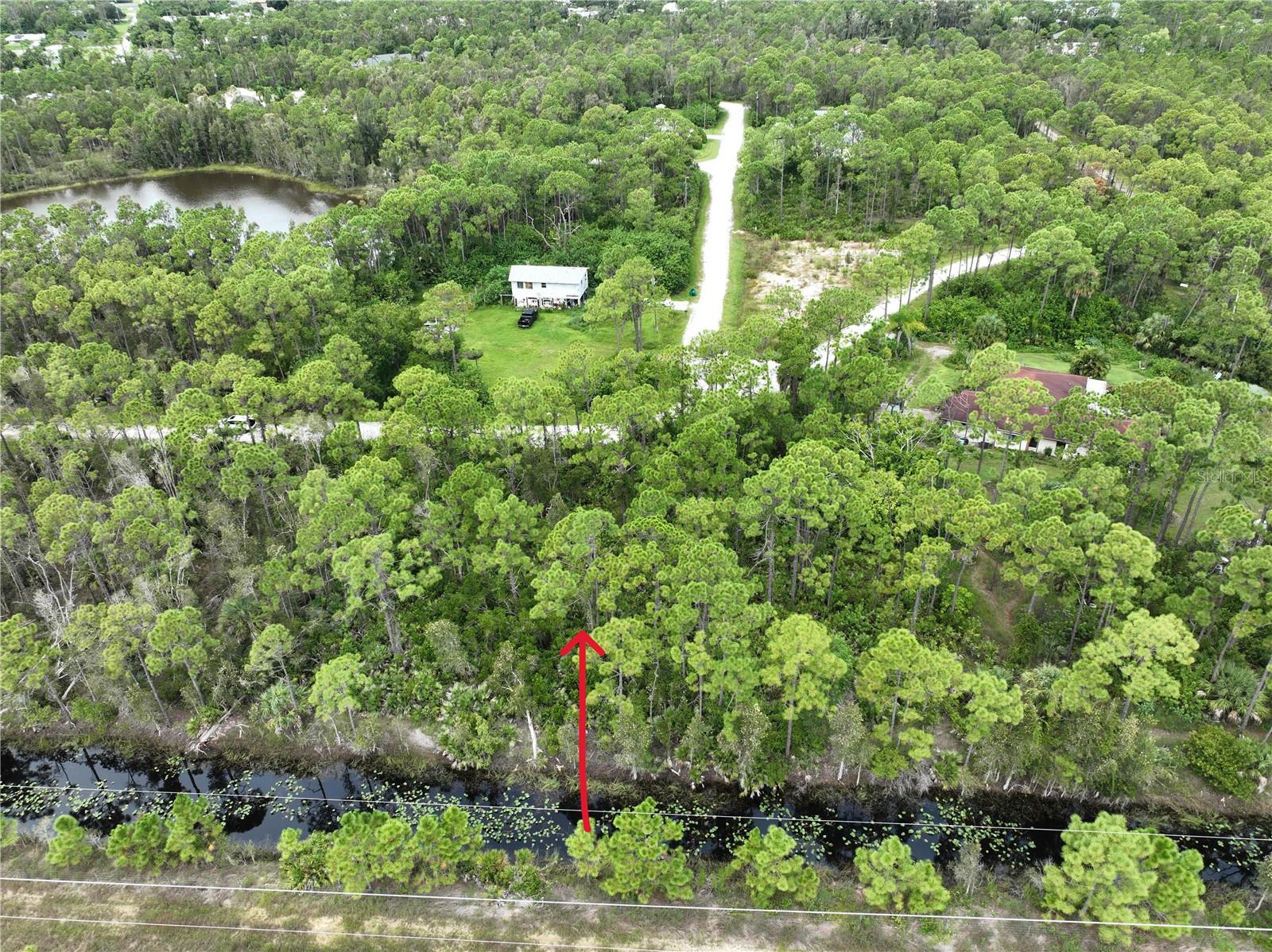 Great privacy lot, no rear neighbors with small water view. With and easy access to US 41 and I-75. Quiet country-like setting but close to everything. NO HOA, this is the perfect lot! Utilities are available nearby, and the property will require a well and septic system. Lot is not in a Scrub-Jay area. Close to Golf Courses, Historic Downtown Punta Gorda, Fisherman's Village where you can enjoy Waterfront Dining, Unique Boutiques, Sunset Cruises and Fishing Charters for World Class Fishing. Punta Gorda Airport is a few miles away. The lot next door is also available!